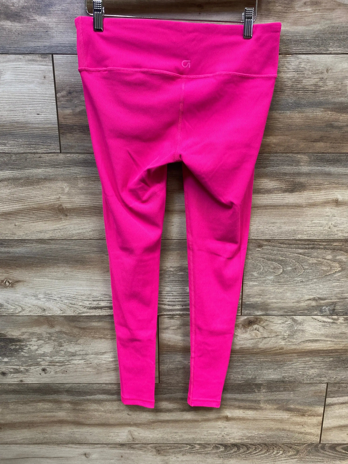 Front view of pink Gap Fit maternity under-belly rib leggings, size small, showing high ribbed waistband on wood background