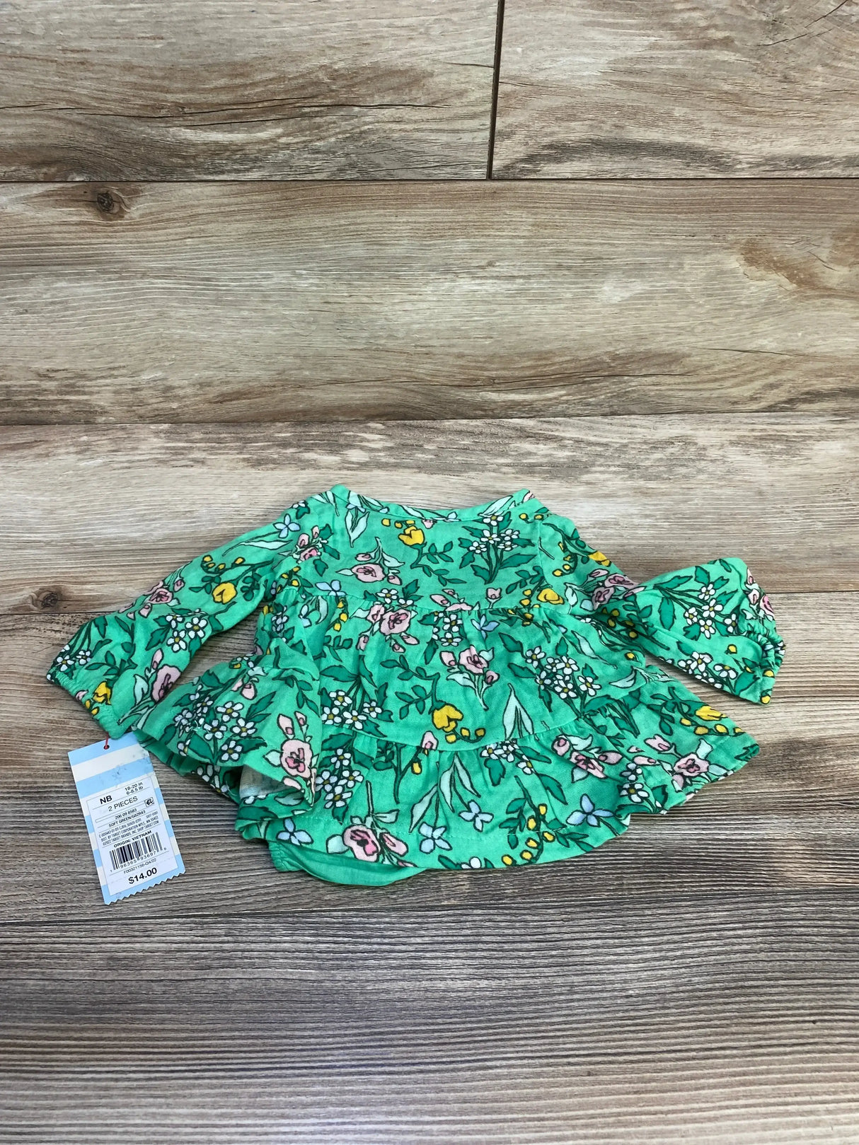 Front view of Cat and Jack newborn henley dress with matching bloomers, green floral print on white background