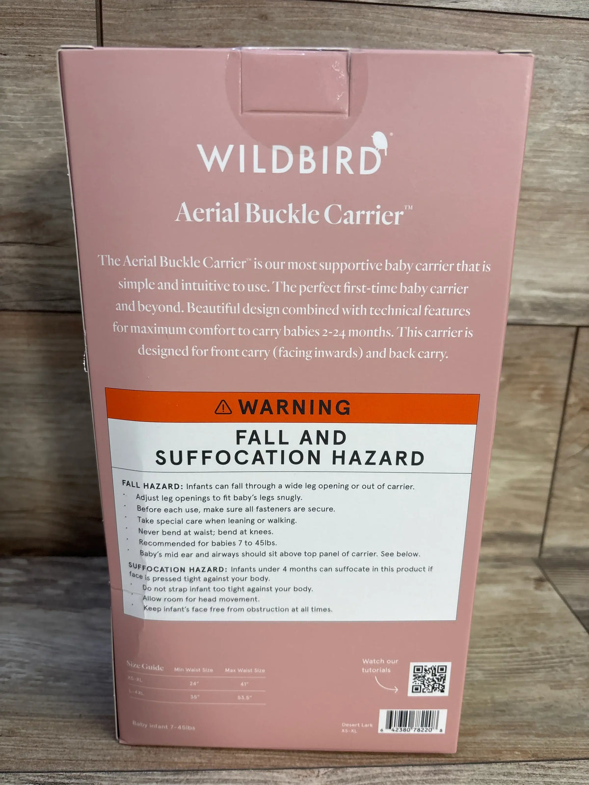 WildBird Aerial Buckle Carrier box back with fall and suffocation hazard warnings, XS-XL size guide, and Desert Lark label