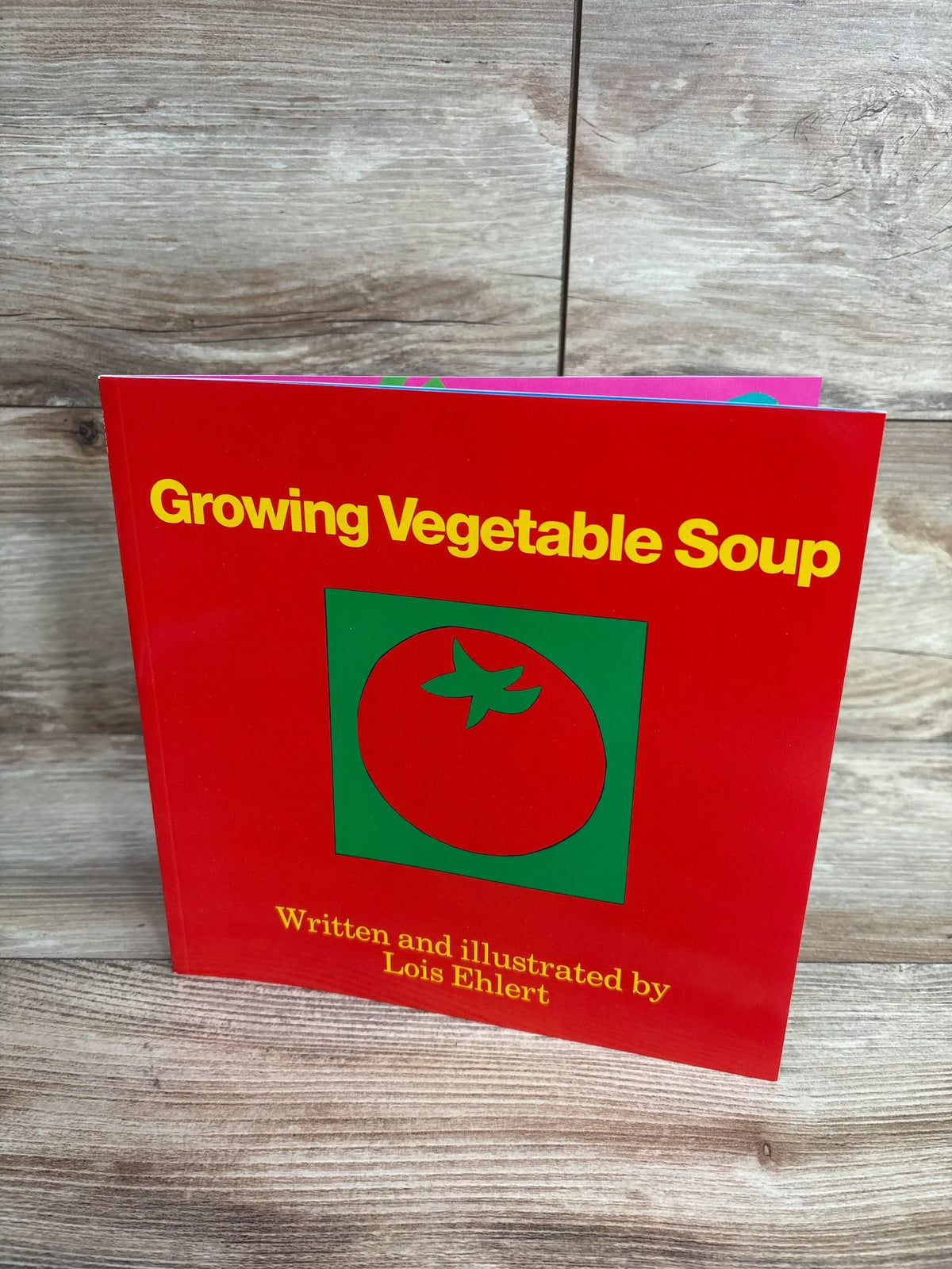 Red children's book titled Growing Vegetable Soup with tomato illustration, by Lois Ehlert