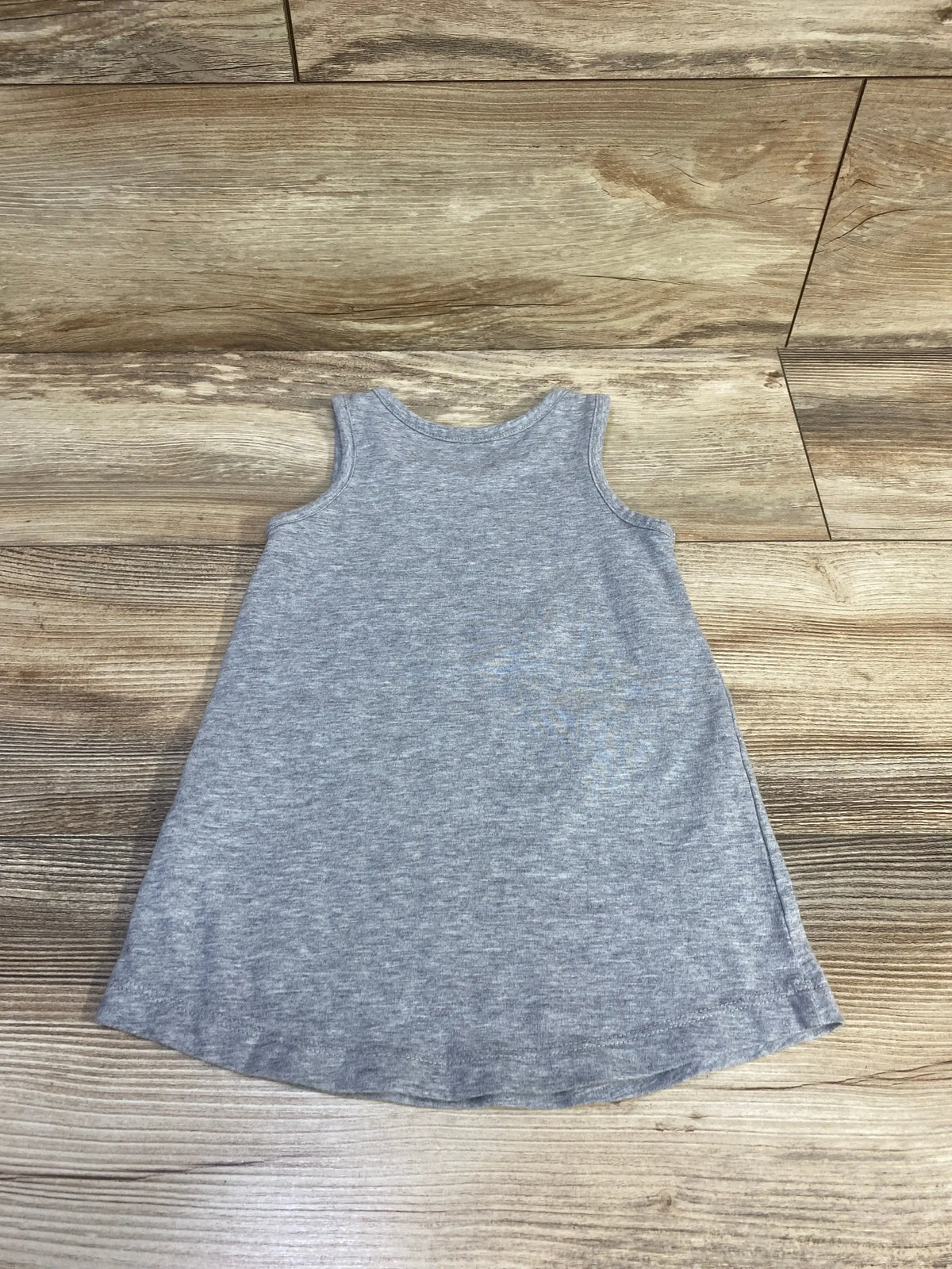 Back view of Nike logo tank dress in heather grey with racerback on wood plank floor sz 2T