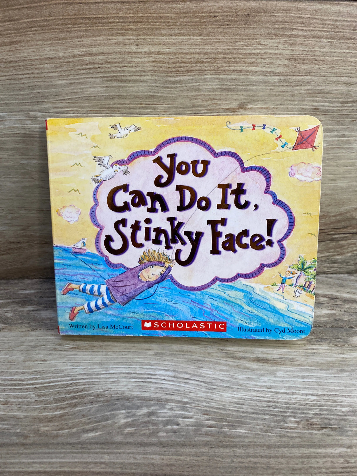 You Can Do It Stinky Face children's book cover on wood table, Scholastic, illustrated art
