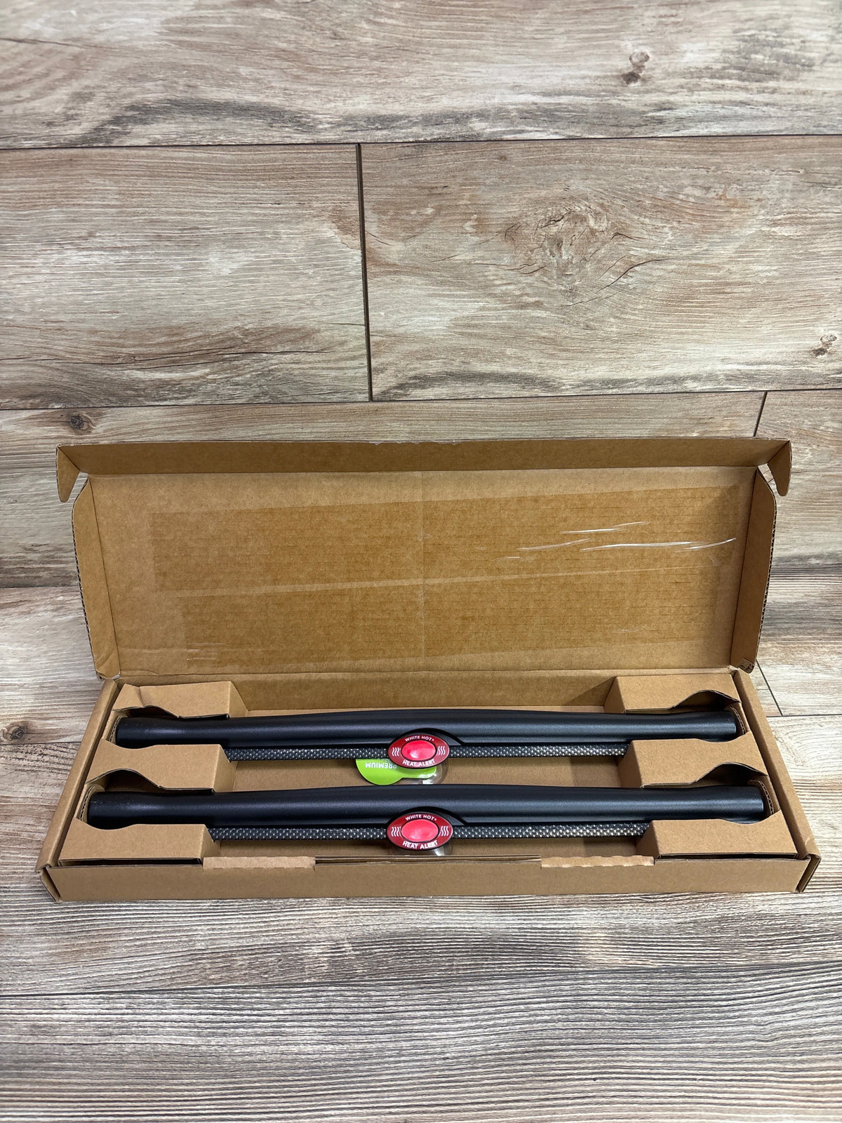Top view of Munchkin Sun Safety Car Window Roller Shades 2pk showcasing two black shades in an open box