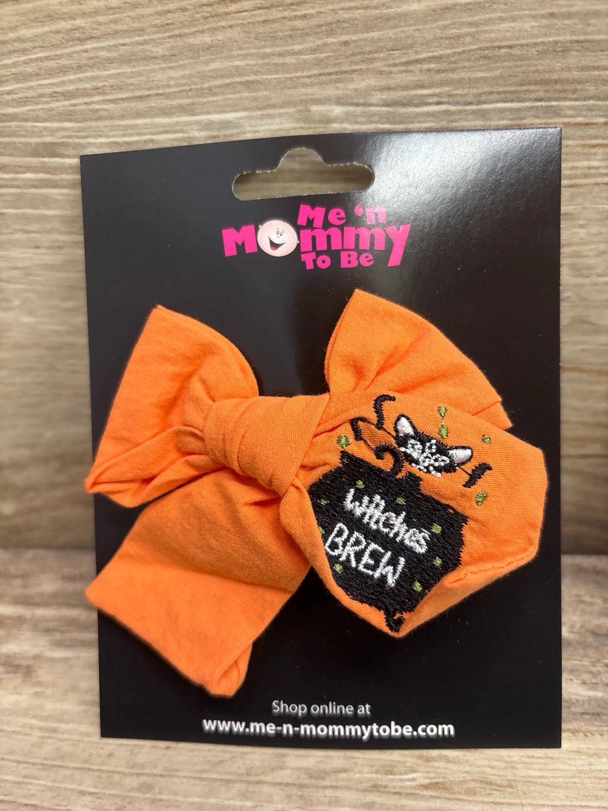 Orange embroidered Halloween cloth hair bow with a 'Witches Brew' cauldron design