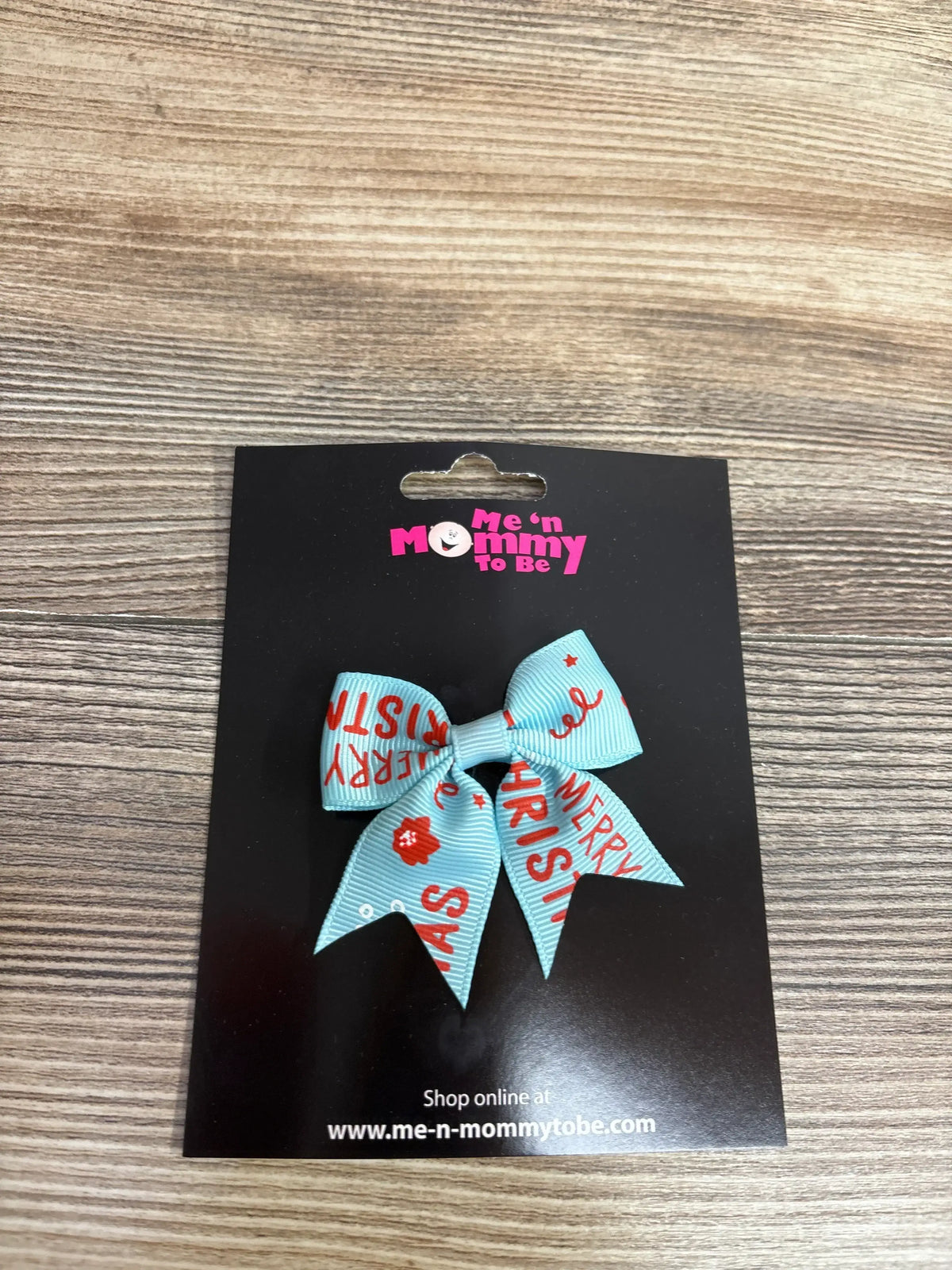 Light blue Merry Christmas hair bow with red text, perfect for kids' holiday outfits