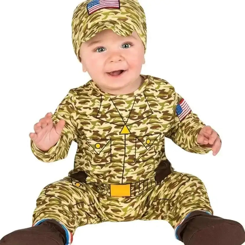 Front view of Rubie’s baby army man costume with camouflage print, cap, flag patches, and boot covers on white