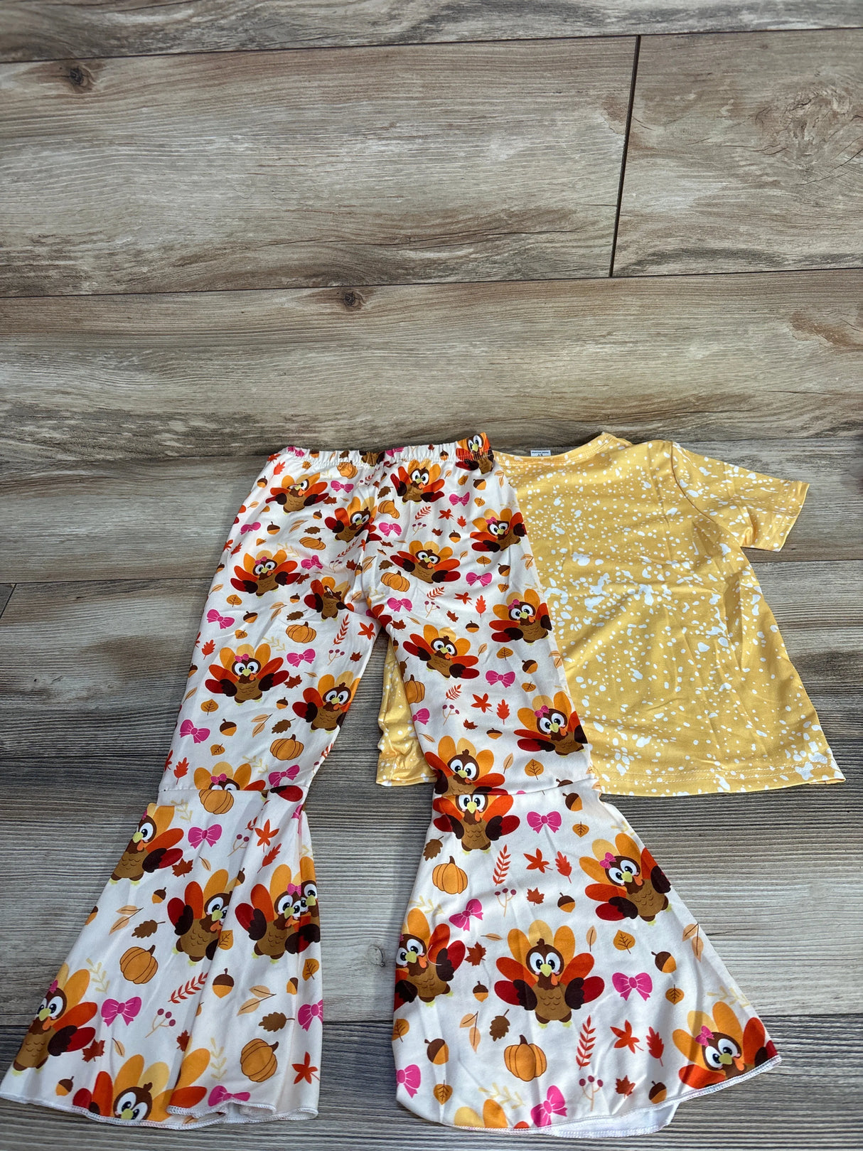 Kids Thanksgiving outfit with yellow polka dot shirt and turkey print bell-bottom pants