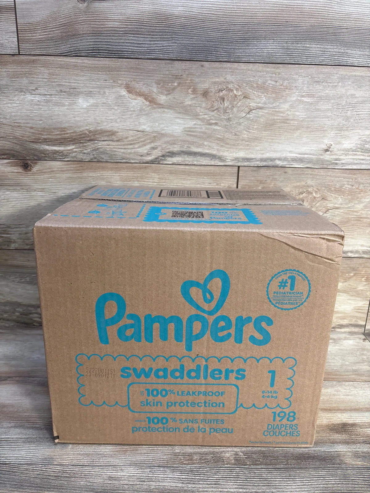 Front view of Pampers Swaddlers diapers, size 1, showcasing 198 count and 100% leakproof skin protection
