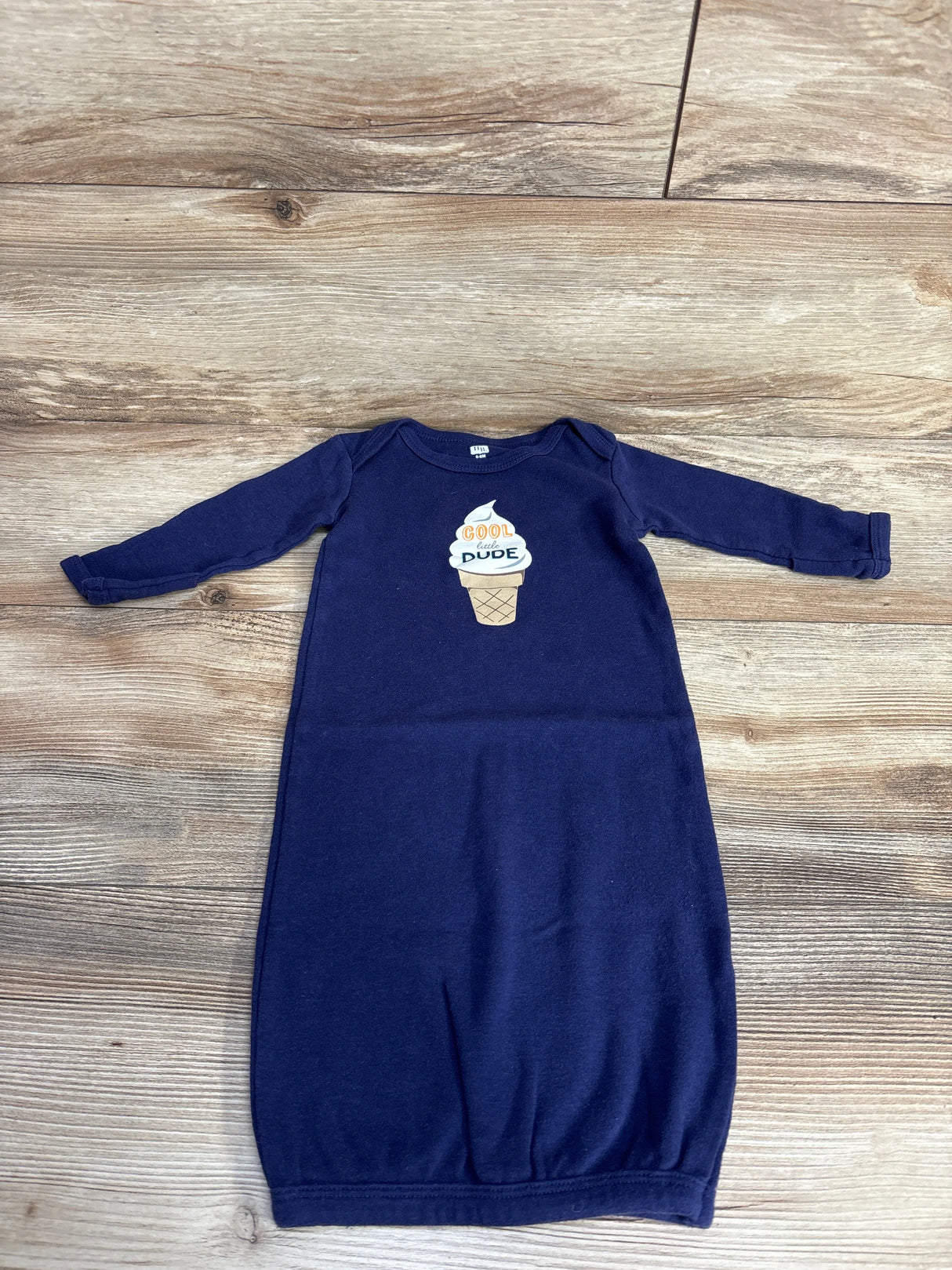 Navy blue baby gown with long sleeves and ice cream cone graphic reading cool little dude