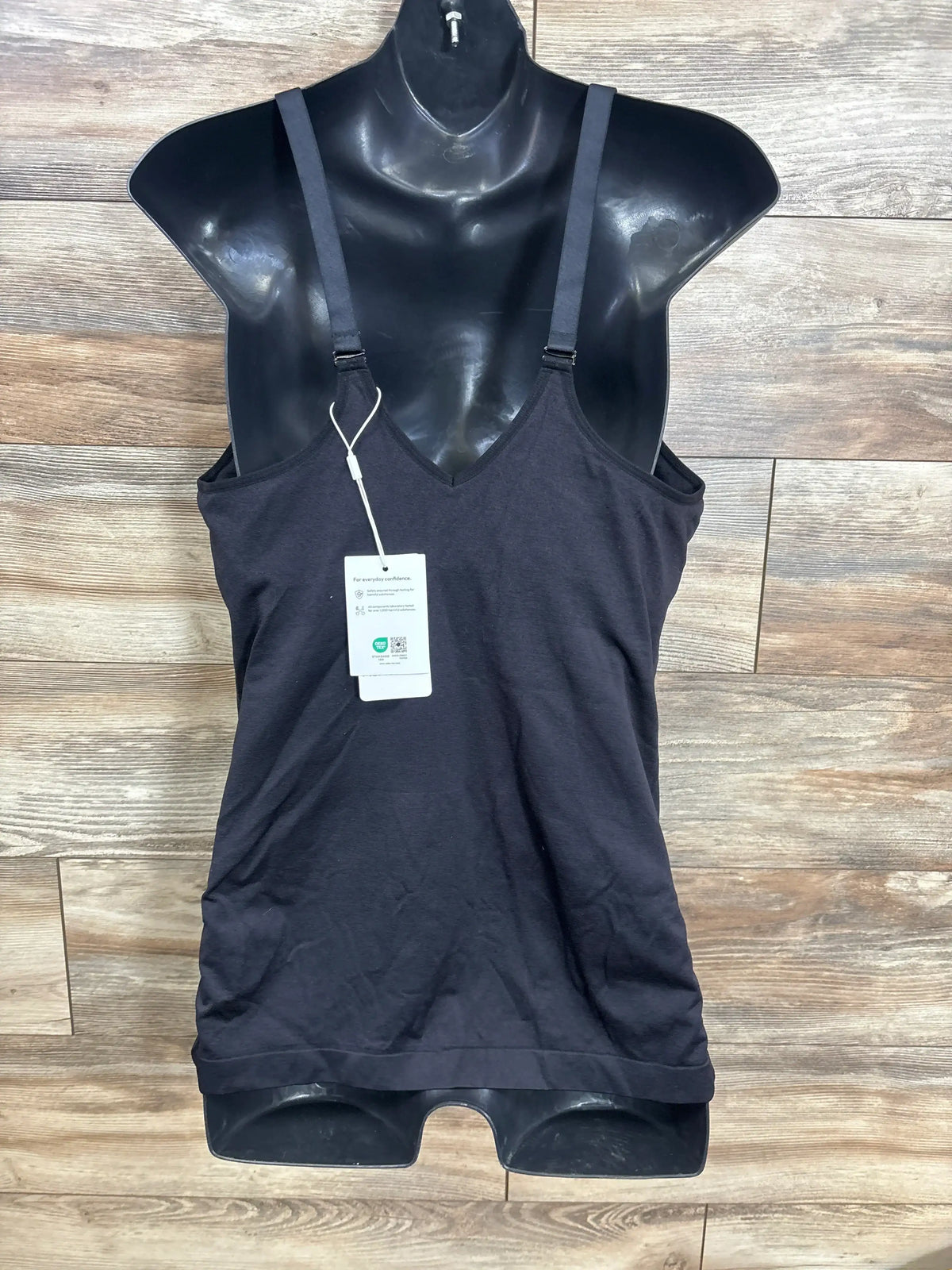 Black maternity tank top with adjustable straps on mannequin, resale kids clothing store