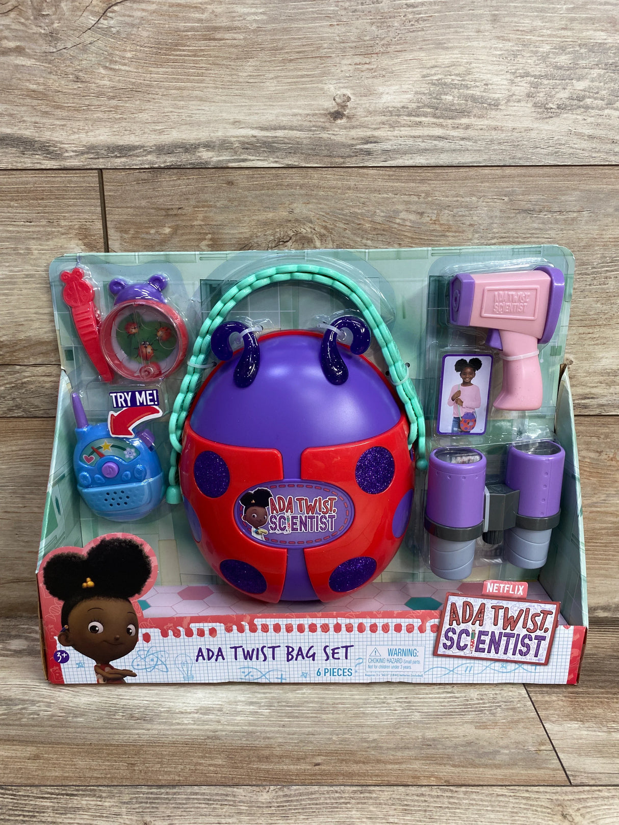 Ada Twist Scientist toy bag set with ladybug-themed bag, walkie-talkie, binoculars, and pink scanner