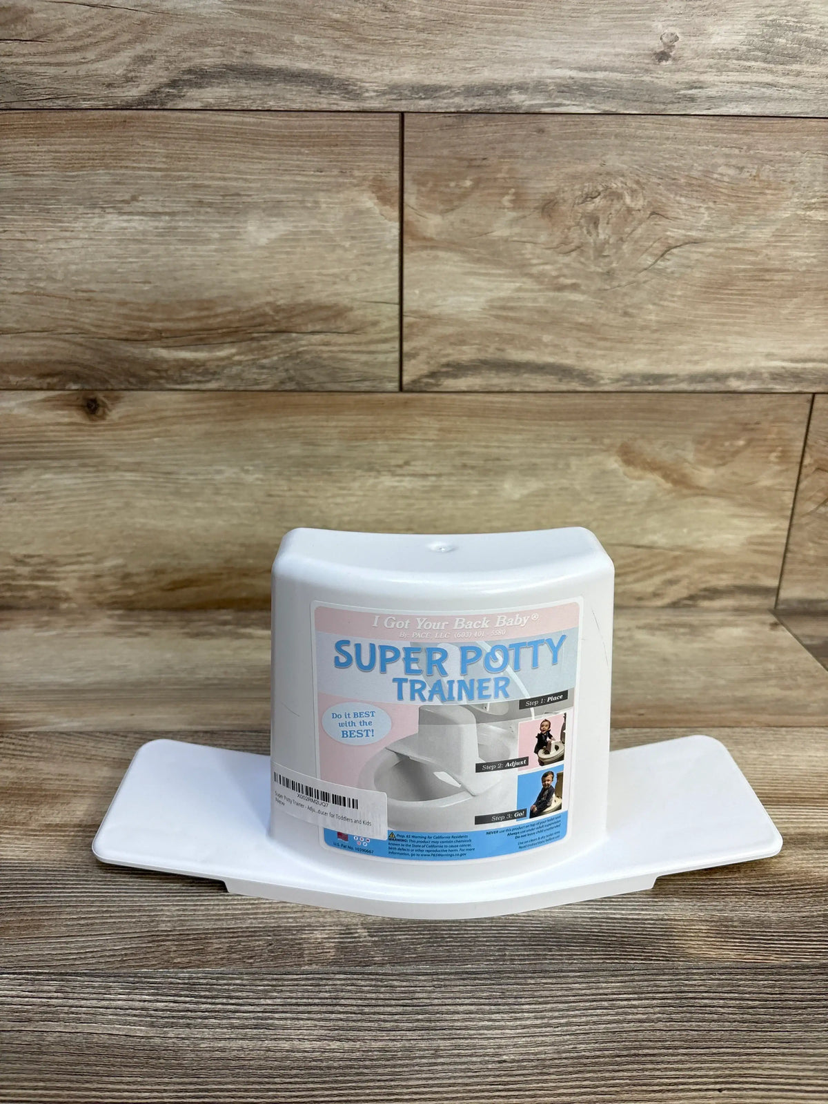 White Super Potty Trainer for toddlers and kids, adjustable toilet seat aid on wood floor
