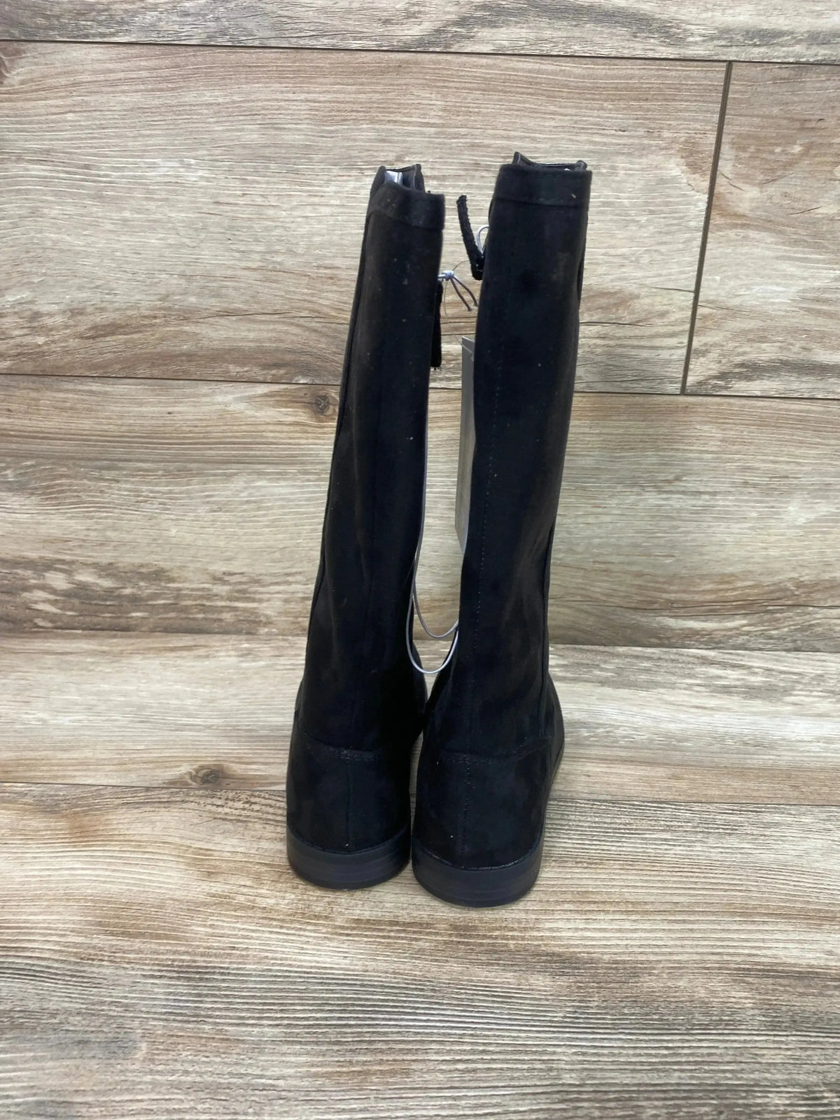 Back view of Cat & Jack Mylah tall black riding boots, size 1Y, suede-look with back zipper on wood floor