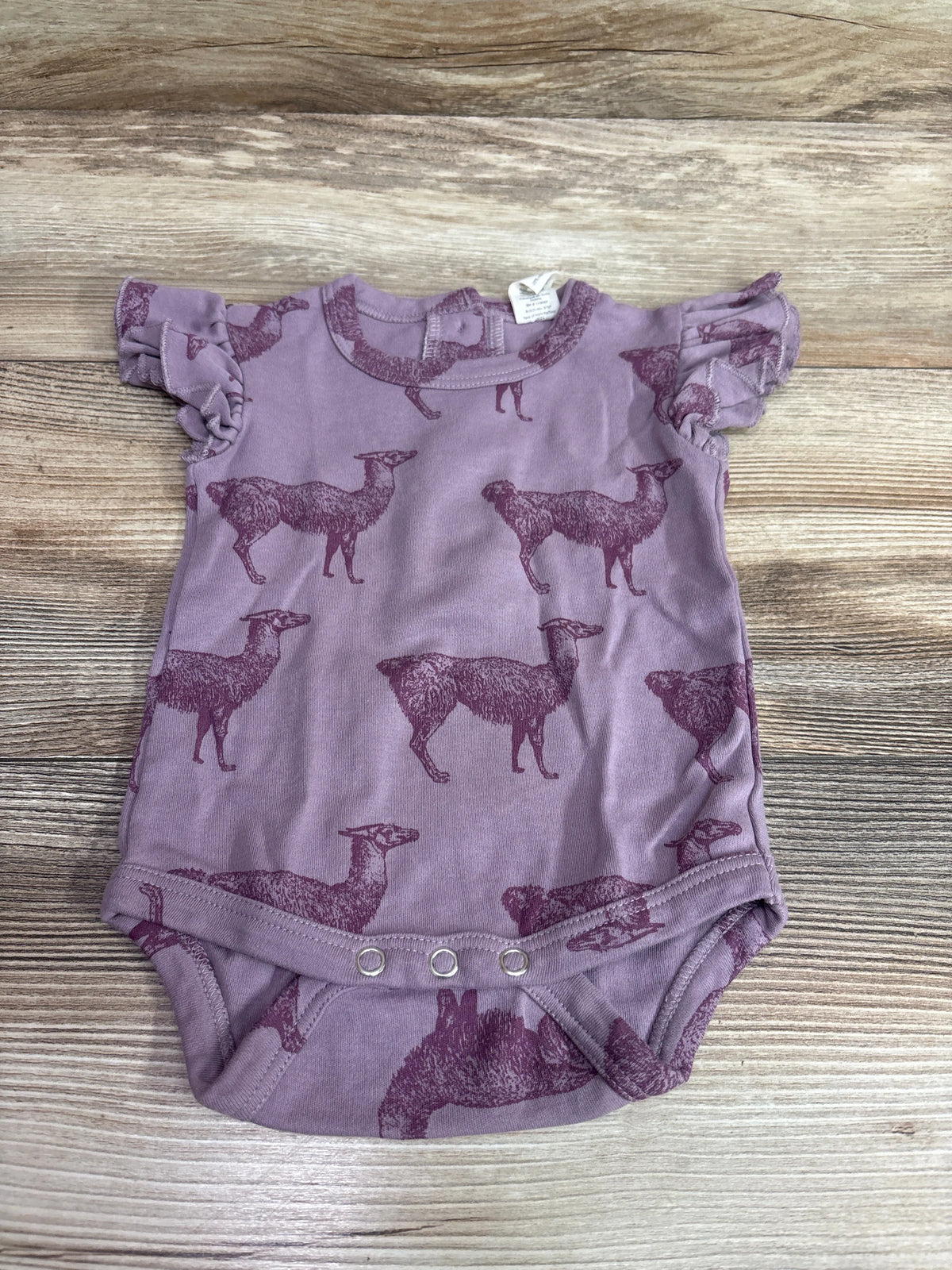 Kate Quinn Organic purple flutter sleeve baby bodysuit with an all-over animal print