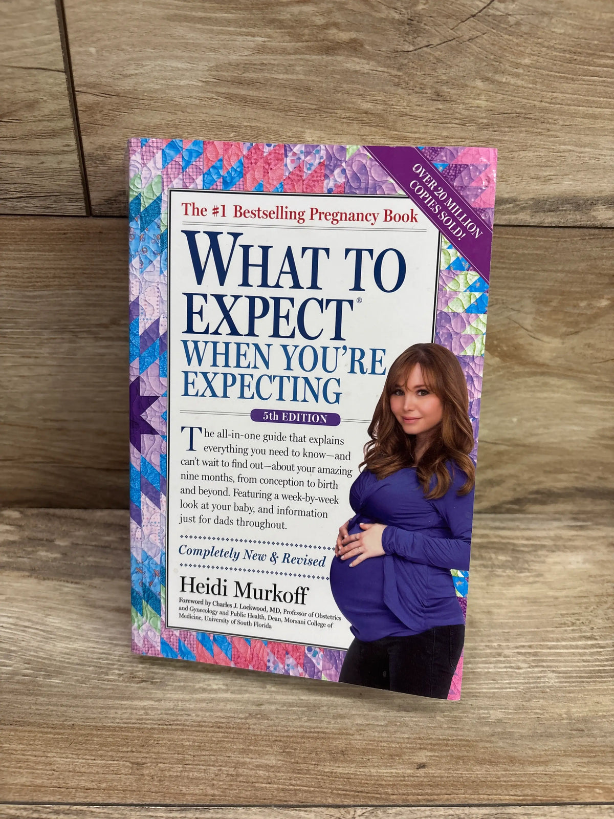 Front view of What to Expect When You’re Expecting 5th Edition paperback book showcasing colorful cover and pregnant woman