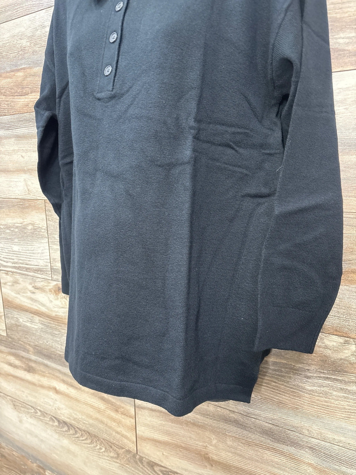 Front view of Gap CashSoft maternity polo sweater size large showing three-button placket and long sleeves on wood background