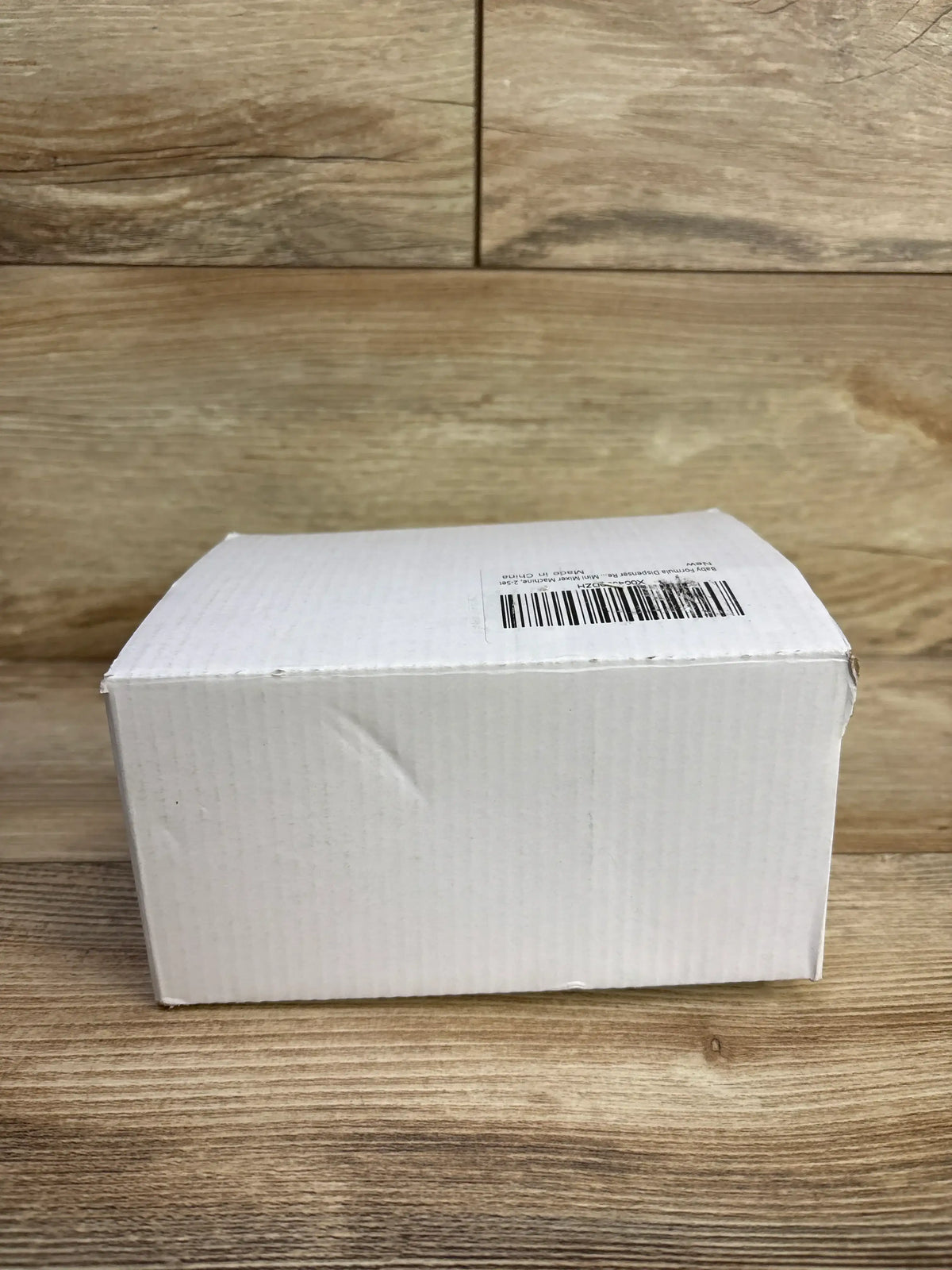 Packaged NEW Mixzeny Formula Dispenser Replacement Funnel for Baby Brezza Formula Pro Mini in a white box on wood