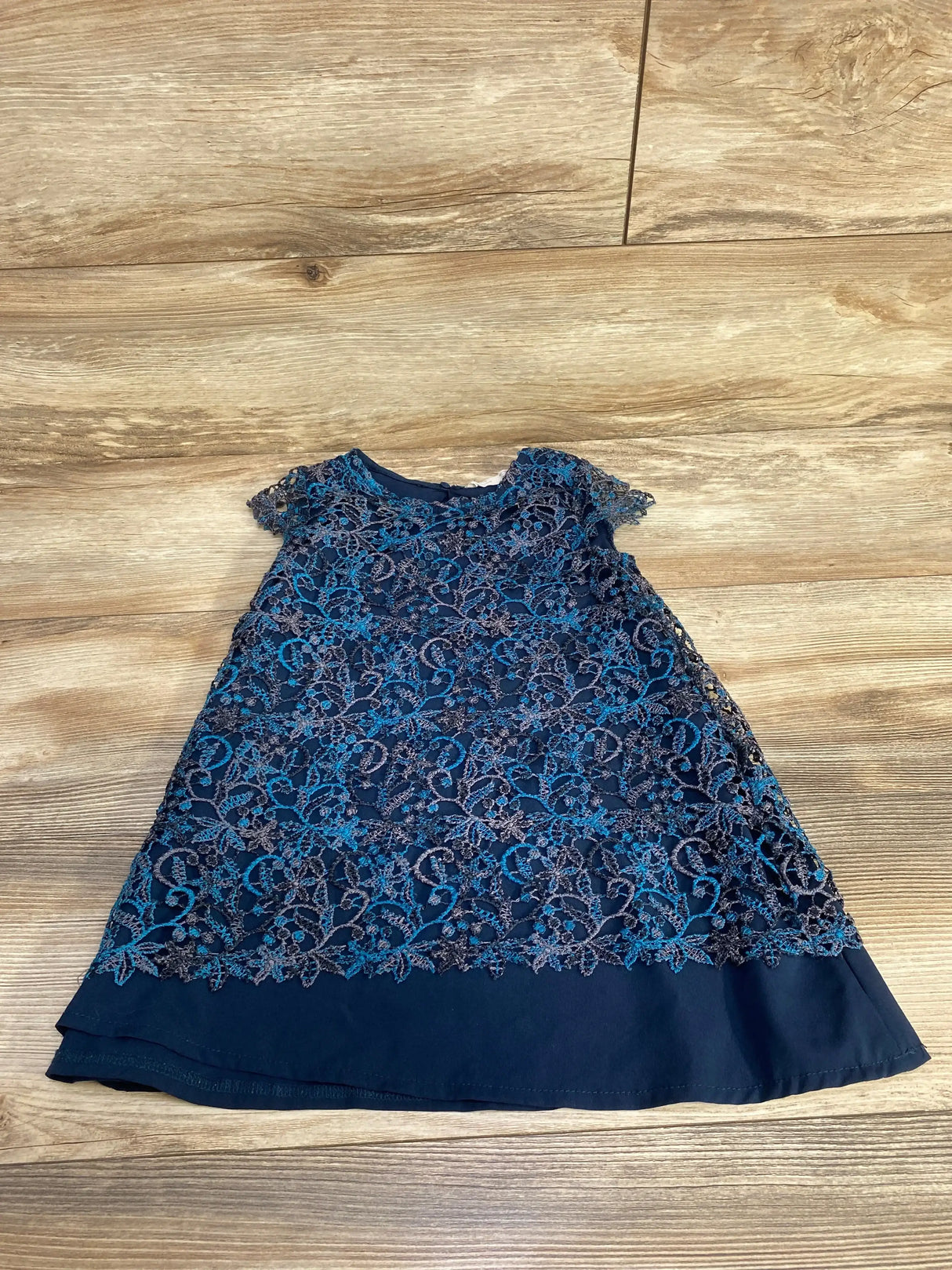 Front view of Zara navy blue lace overlay toddler dress size 5 showing lace bodice and A-line skirt on white background
