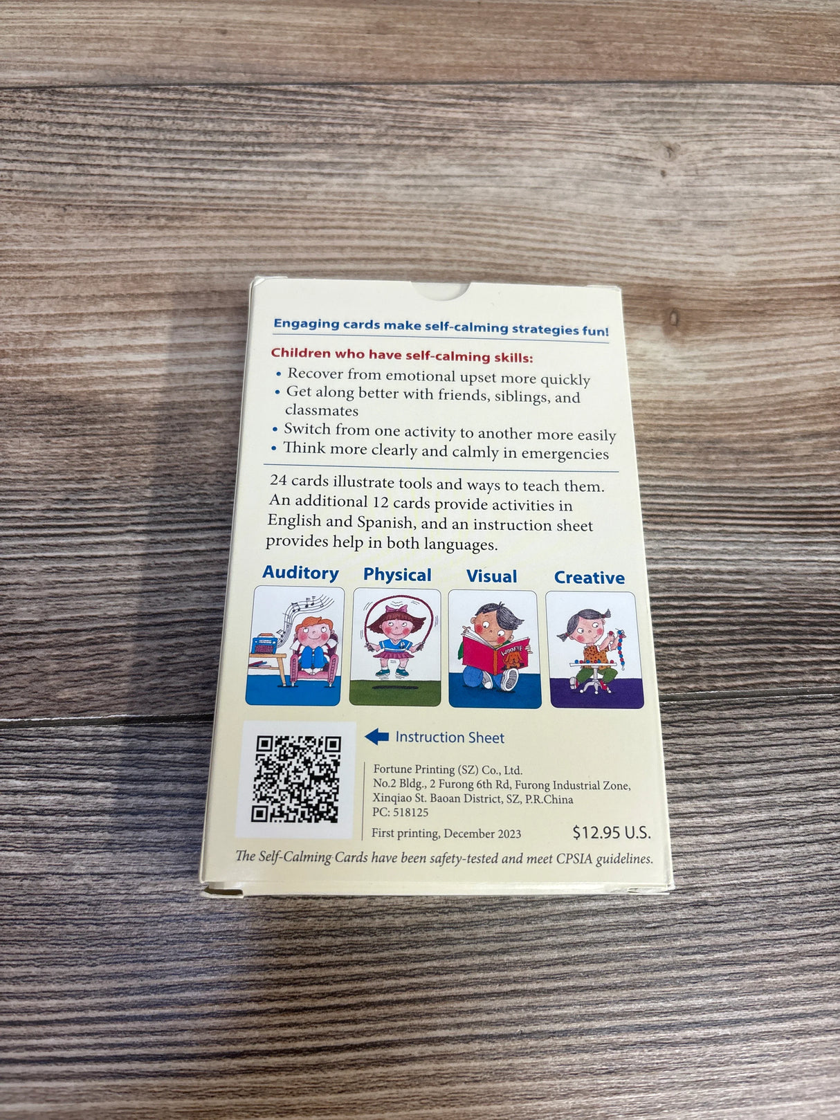 Back of self-calming cards box for children with benefits, illustrations, and price $12.95