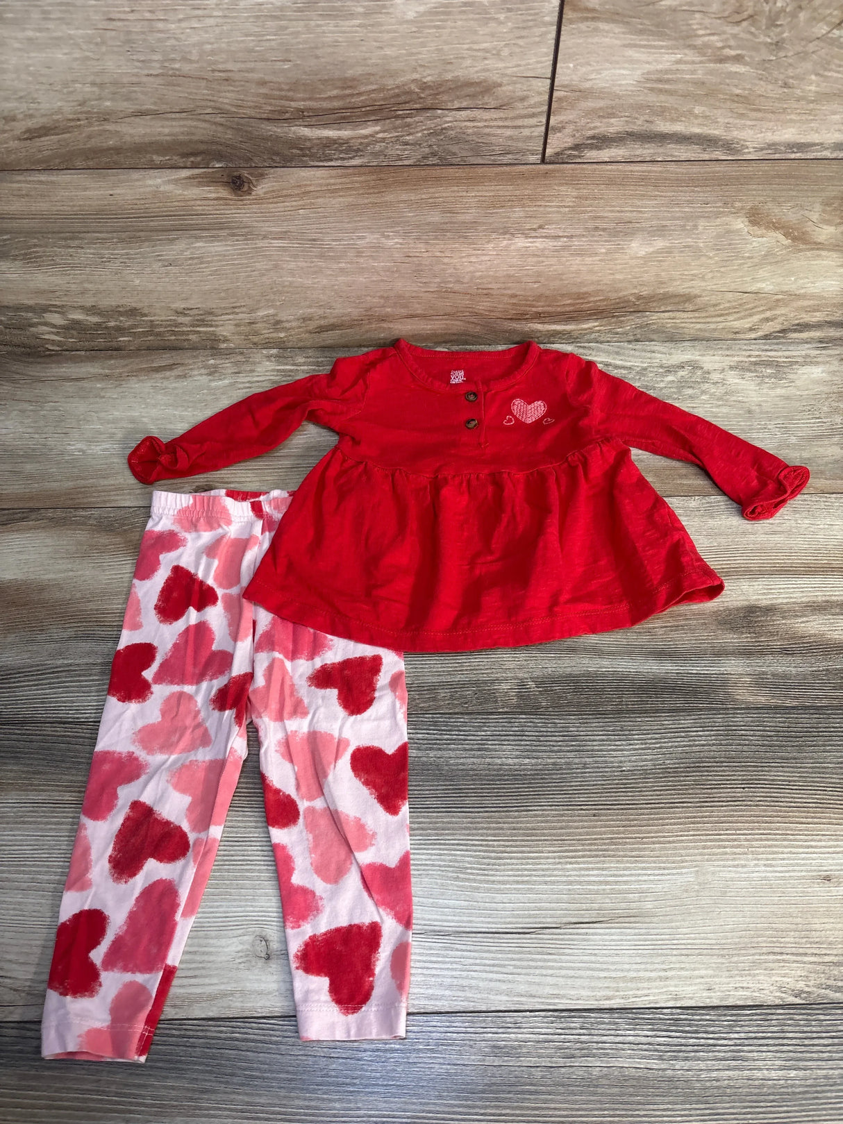 Red long sleeve toddler top with heart detail and pink leggings with red heart prints