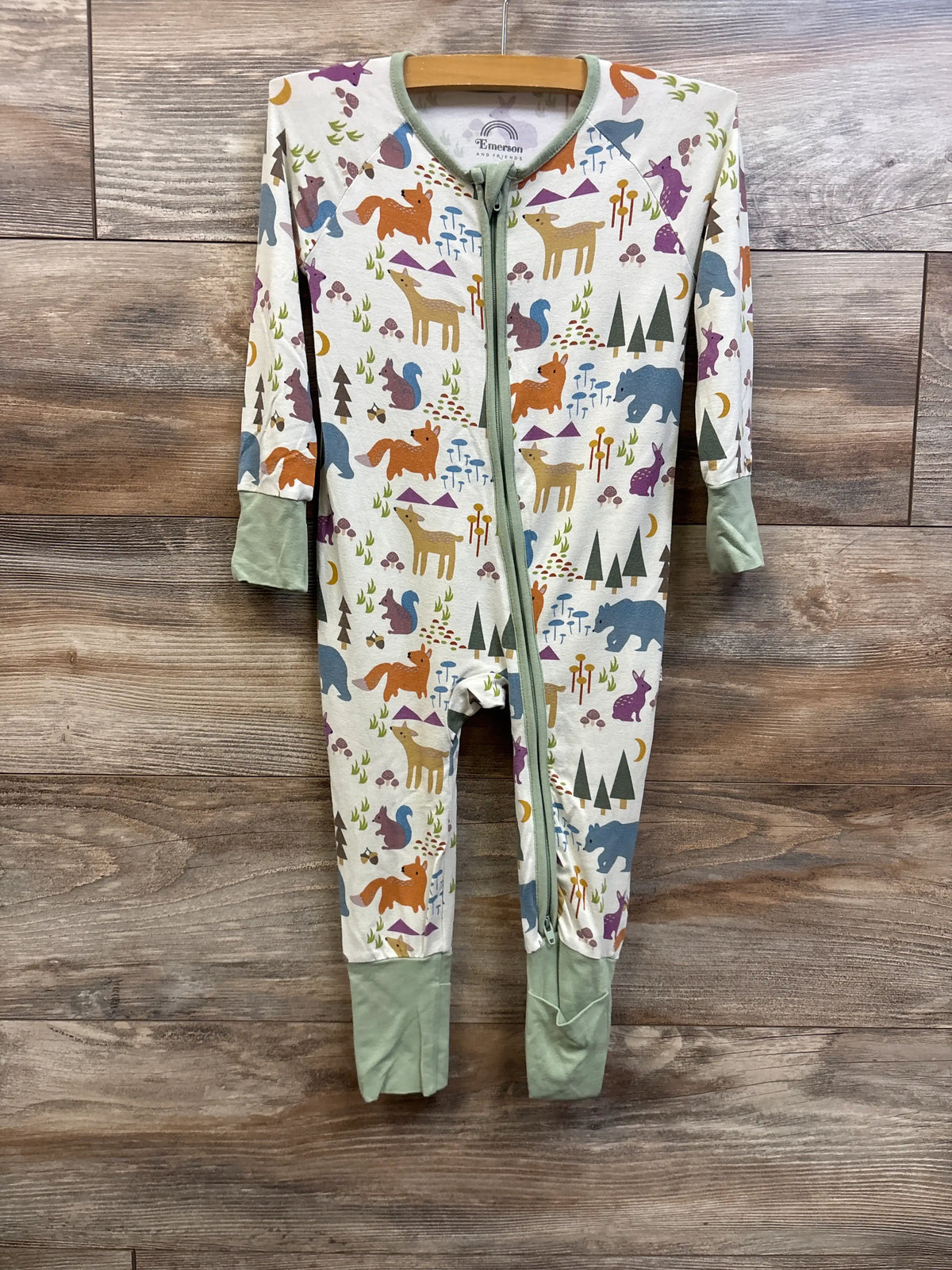 Front view of Emerson and Friends Forest Friends bamboo convertible sleeper showcasing woodland animal print, front zipper, and sage cuffs