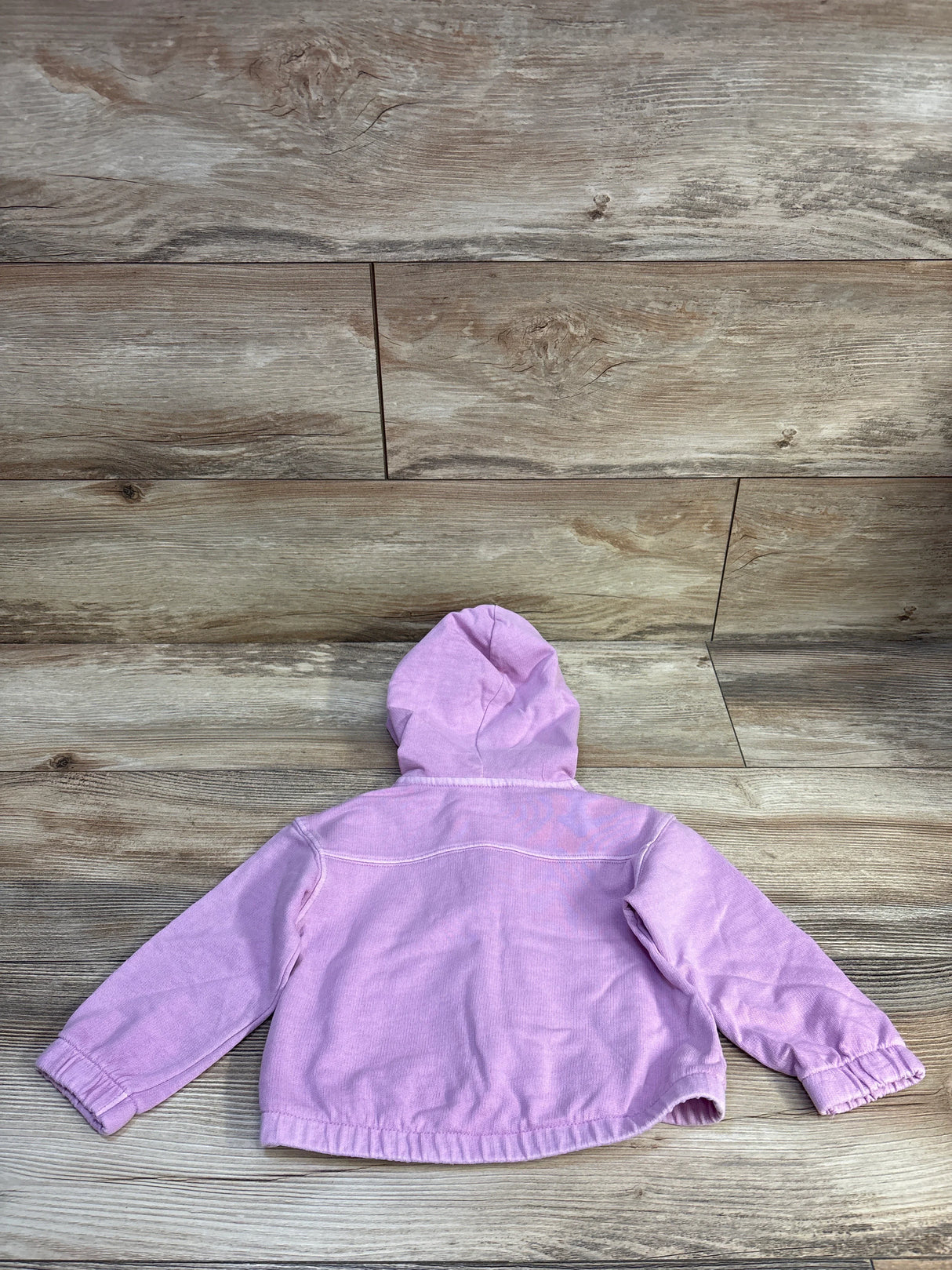 Back view of Cat & Jack full-zip purple baby jacket showcasing hood, elastic cuffs and hem with wood plank background
