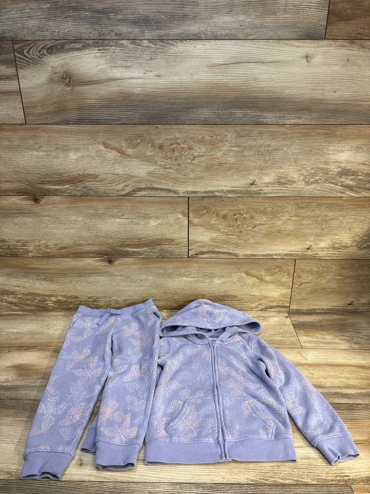 Lavender kids floral hoodie and joggers set on wood floor, cozy children's clothing