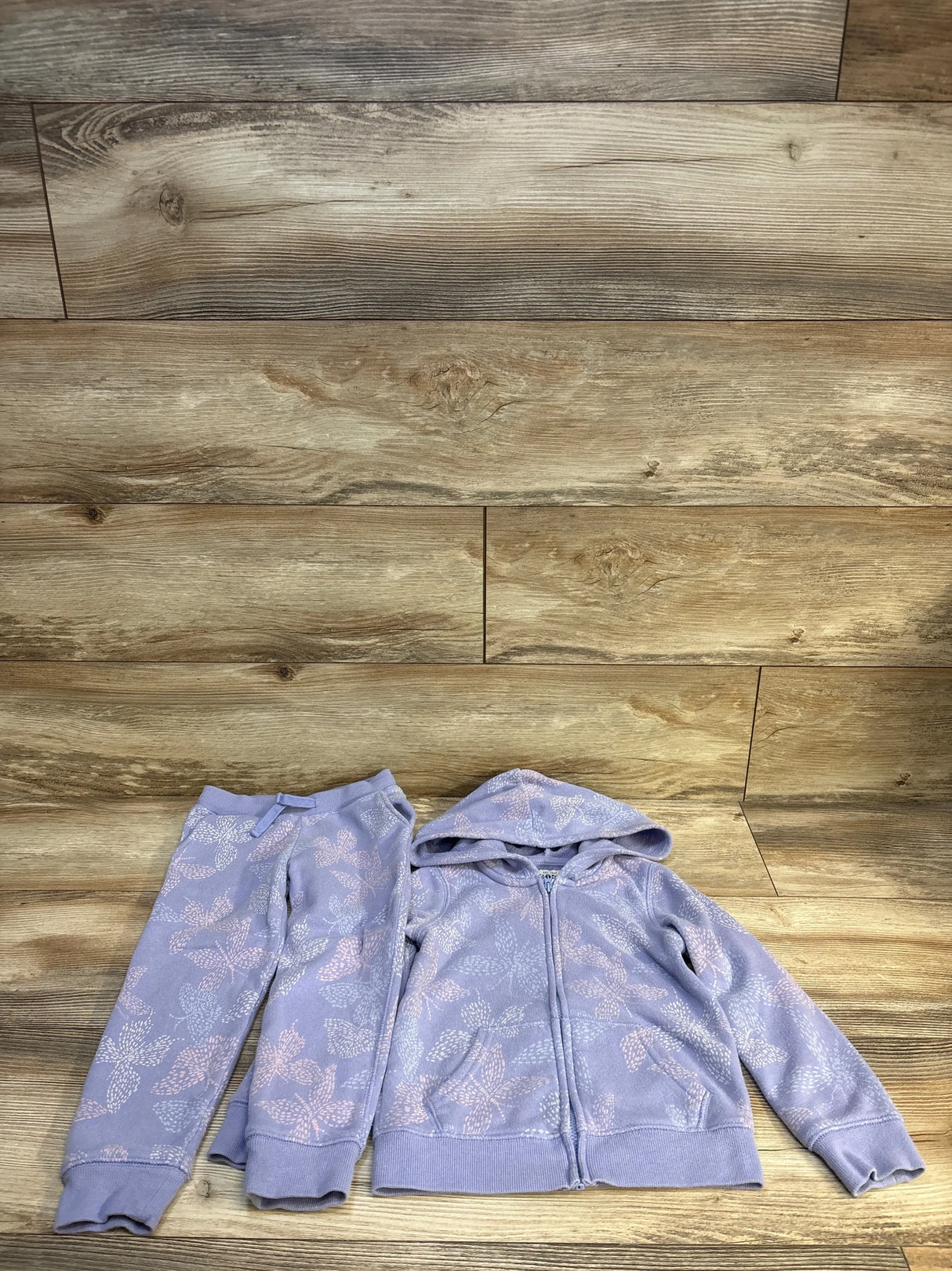 Lavender kids floral hoodie and joggers set on wood floor, cozy children's clothing