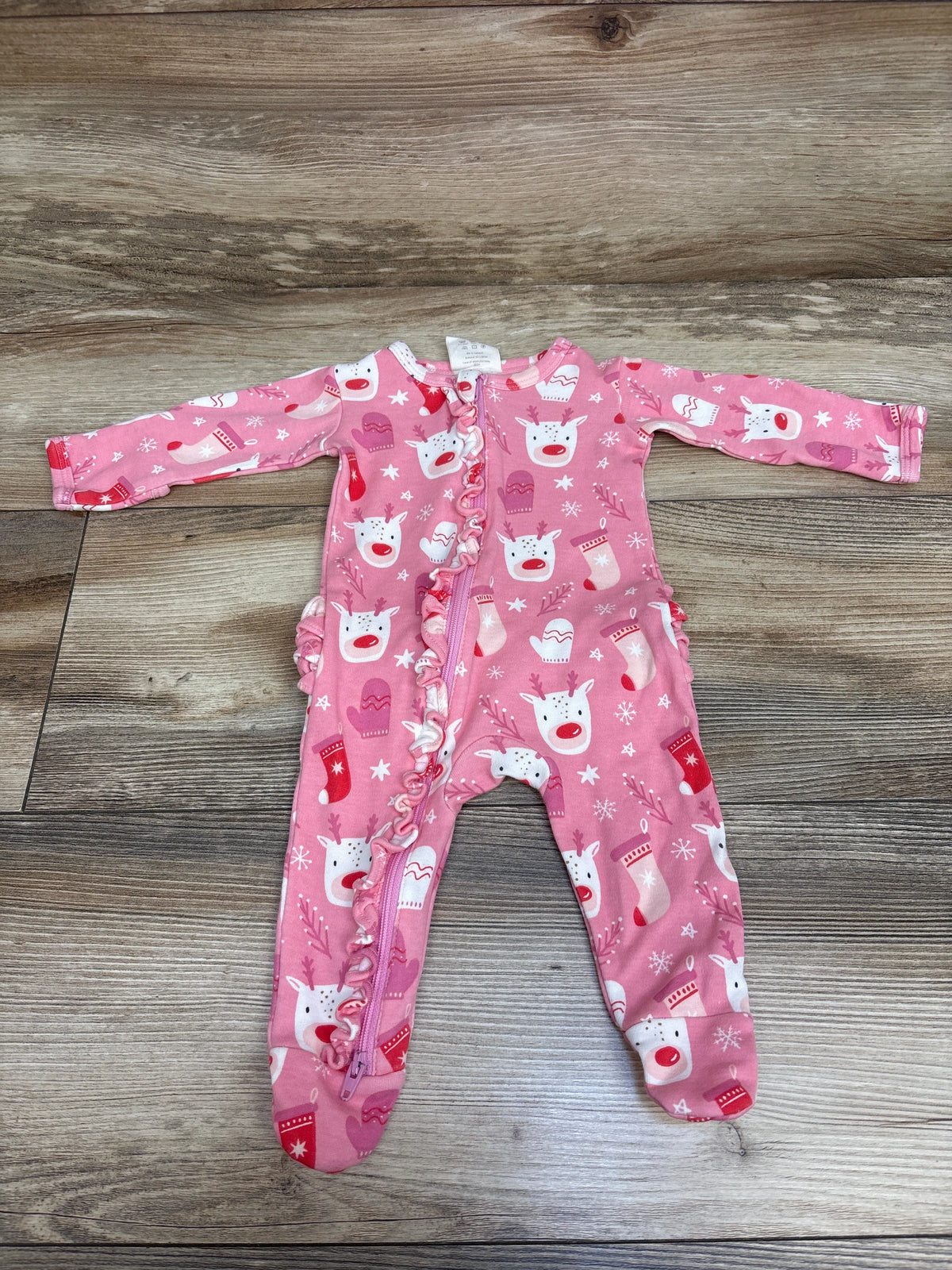 Front view of pink Siix Reindeer Ruffle Frill Zip Footie Sleeper, size 0 to 3 months, with holiday print