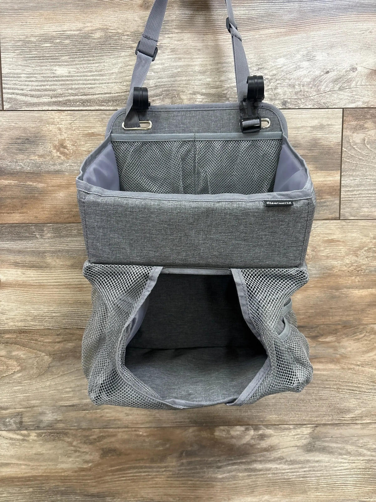 Front view of ClearWorld hanging diaper caddy with top compartment, mesh pocket, lower mesh storage and adjustable straps