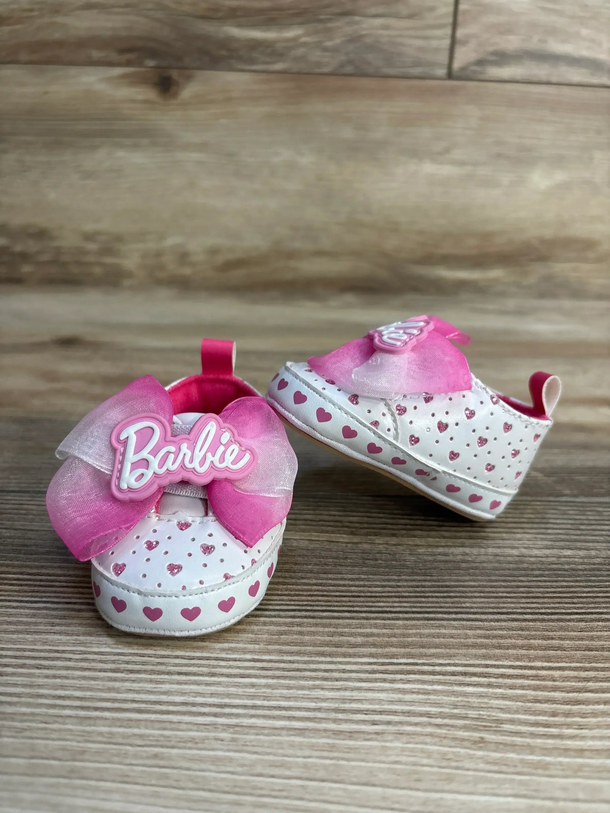 Barbie baby shoes with pink hearts and bows, perfect for little girls