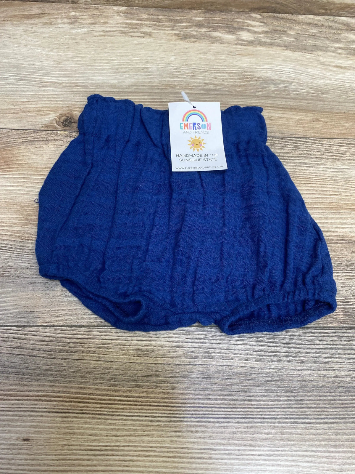 Front view of Emerson and Friends baby pull-on shorts in blue size 0-3 months showing elastic waistband and soft knit texture on white background