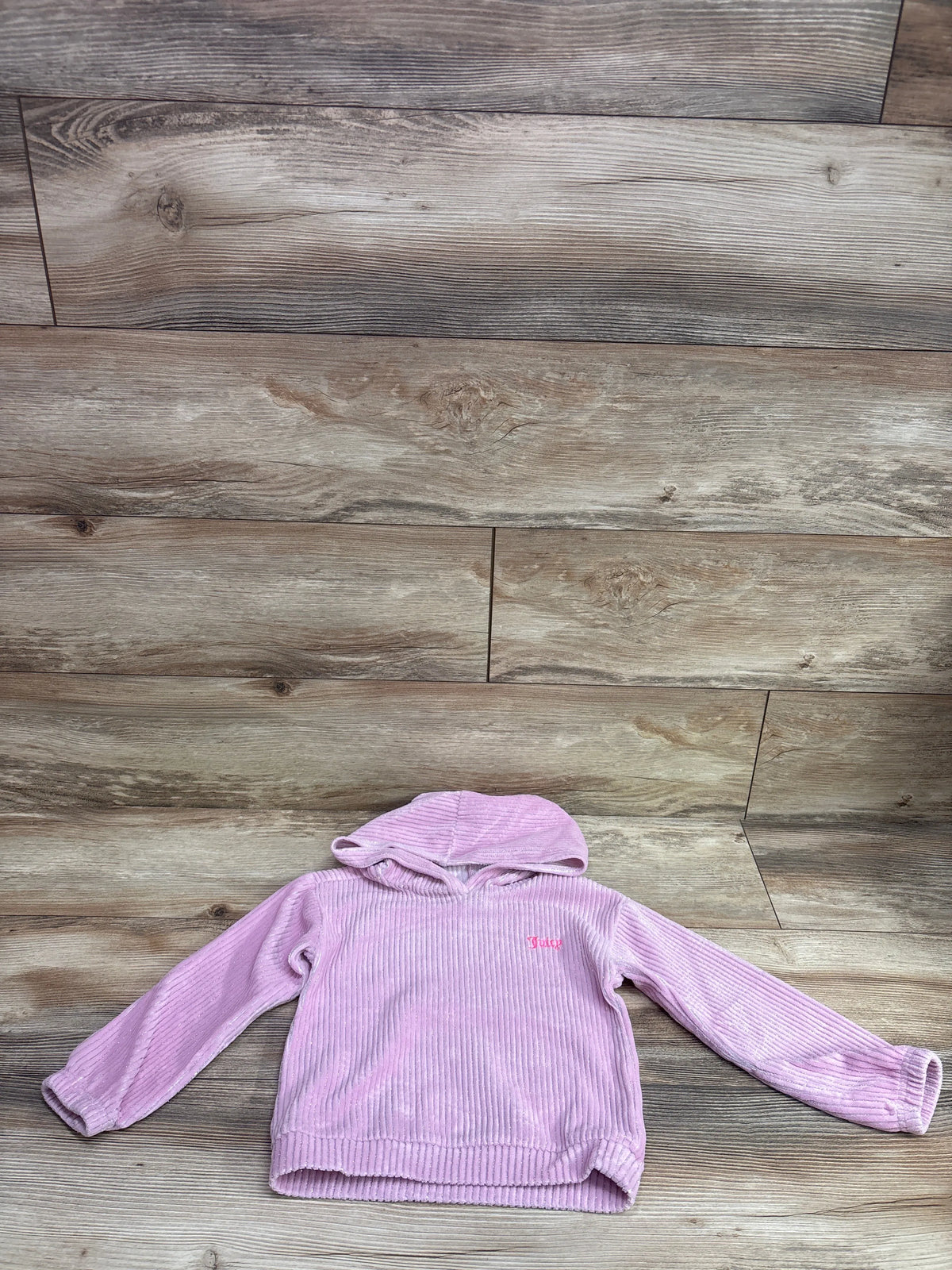 Pink metallic ribbed hooded sweater by Me n Mommy To Be on a wooden background