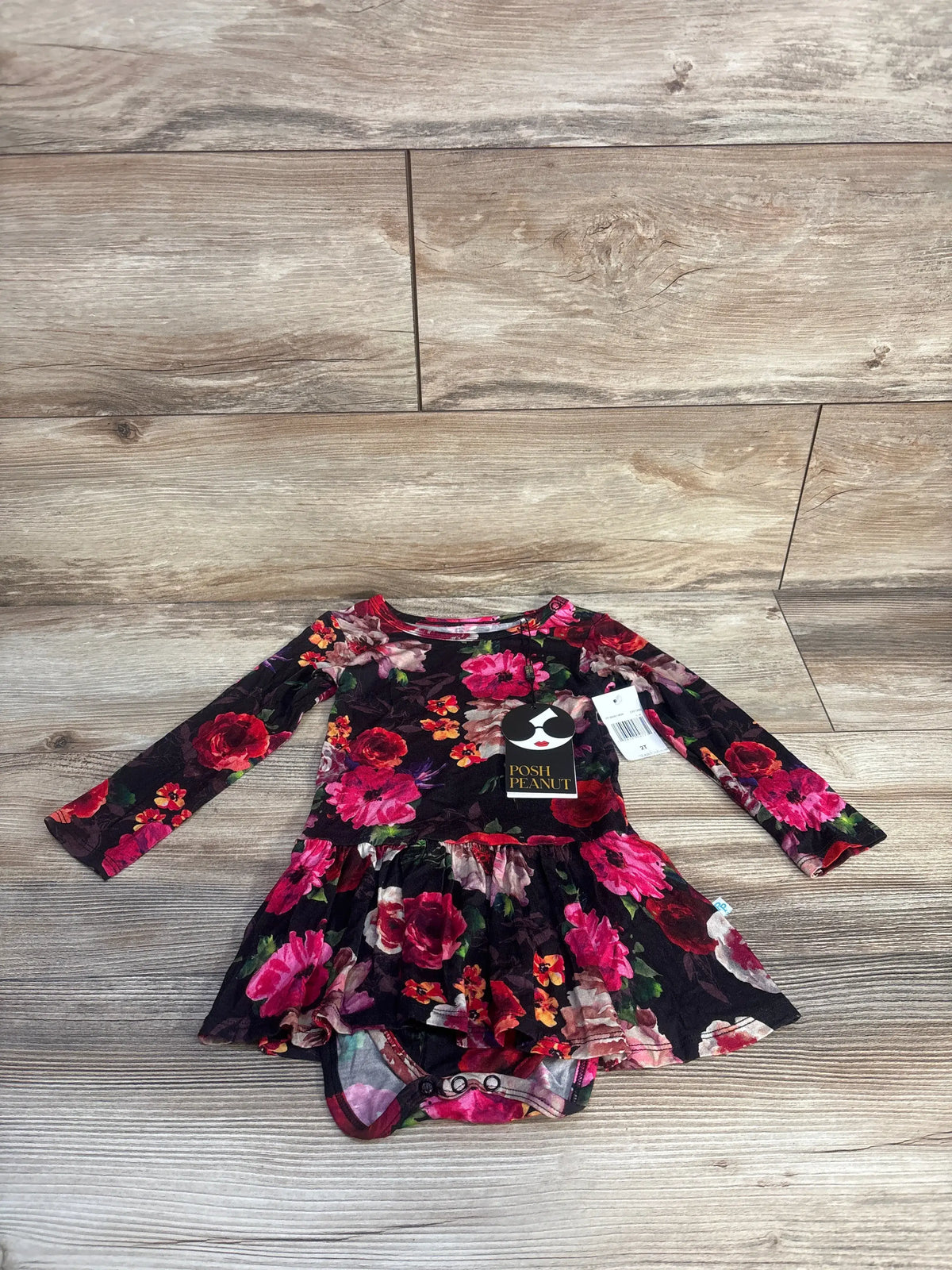 Front view of black twirl skirt bodysuit dress showcasing long sleeves, fitted bodysuit, and floral twirl skirt