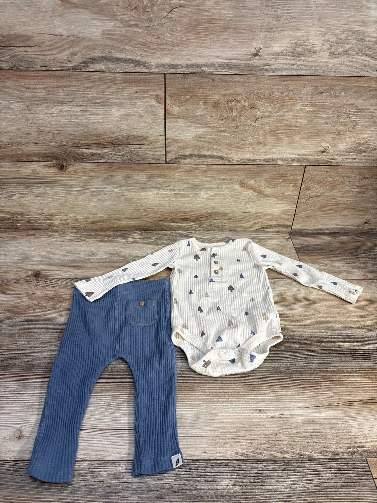 Easy Peasy henley bodysuit and pants set showing ribbed patterned long-sleeve bodysuit, buttons, and elastic-waist pants