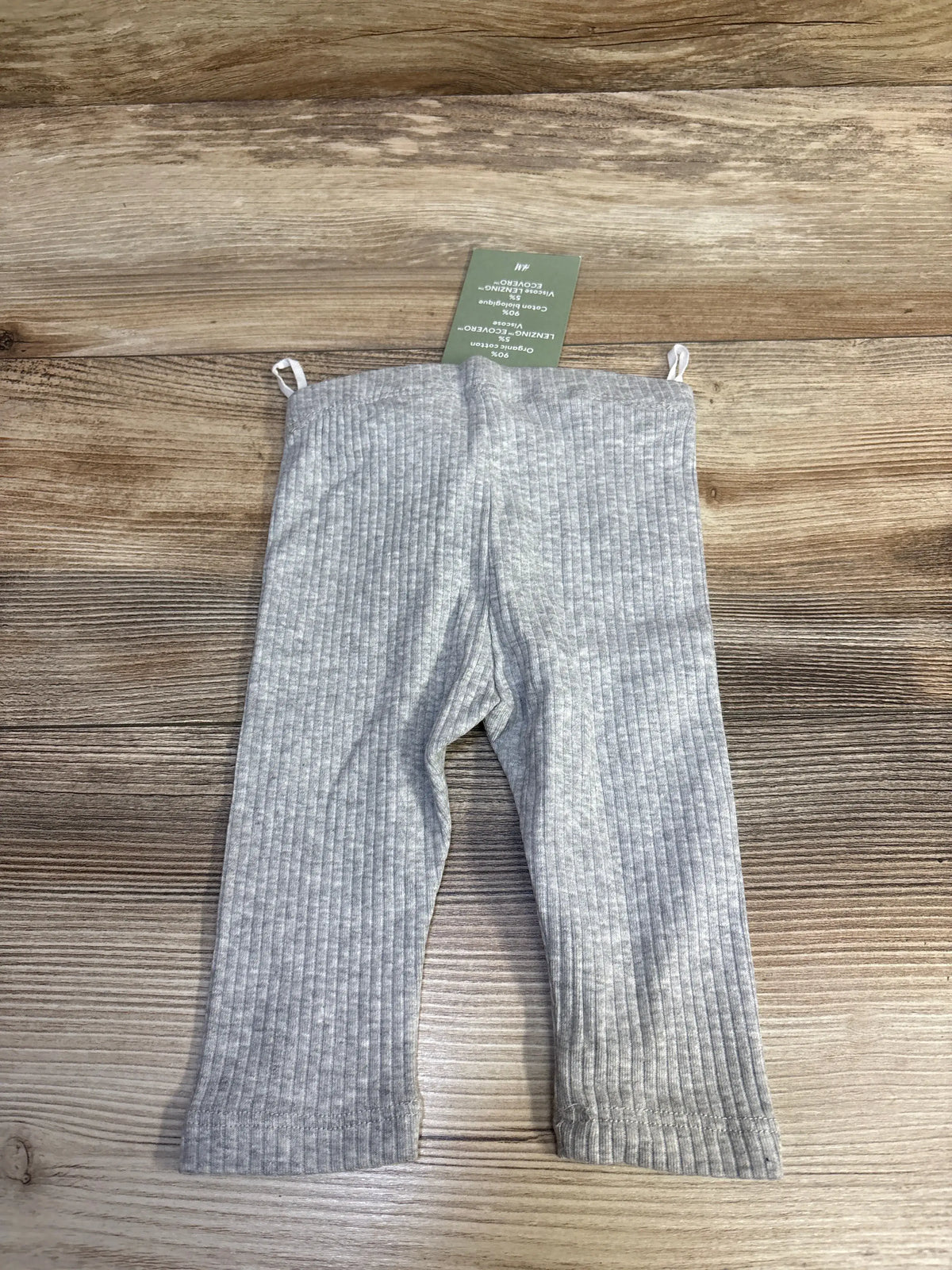 New grey ribbed baby leggings from Me n Mommy To Be on a wooden surface