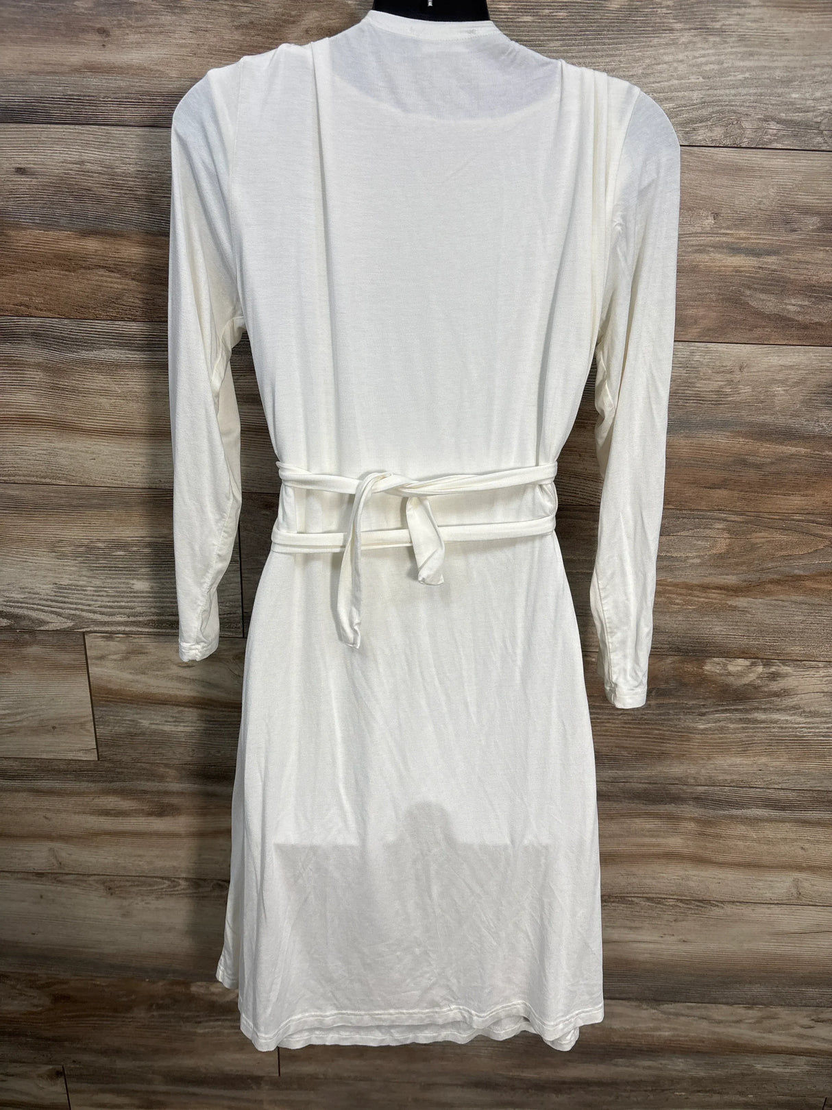 White long sleeve maternity robe with waist tie on wooden background
