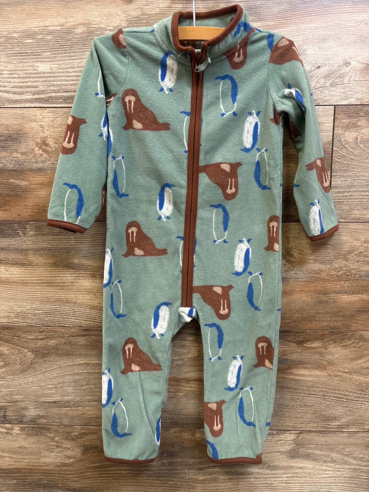 Front view of Carter’s green fleece coverall, size 24 months, with zipper and penguin and walrus print