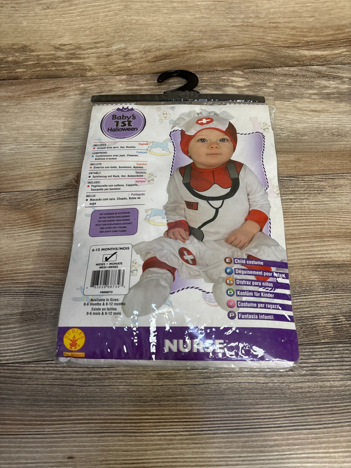 Front view of Rubie’s Baby’s 1st Halloween nurse costume, size 6-12 months, in sealed package with nurse hat and red cross