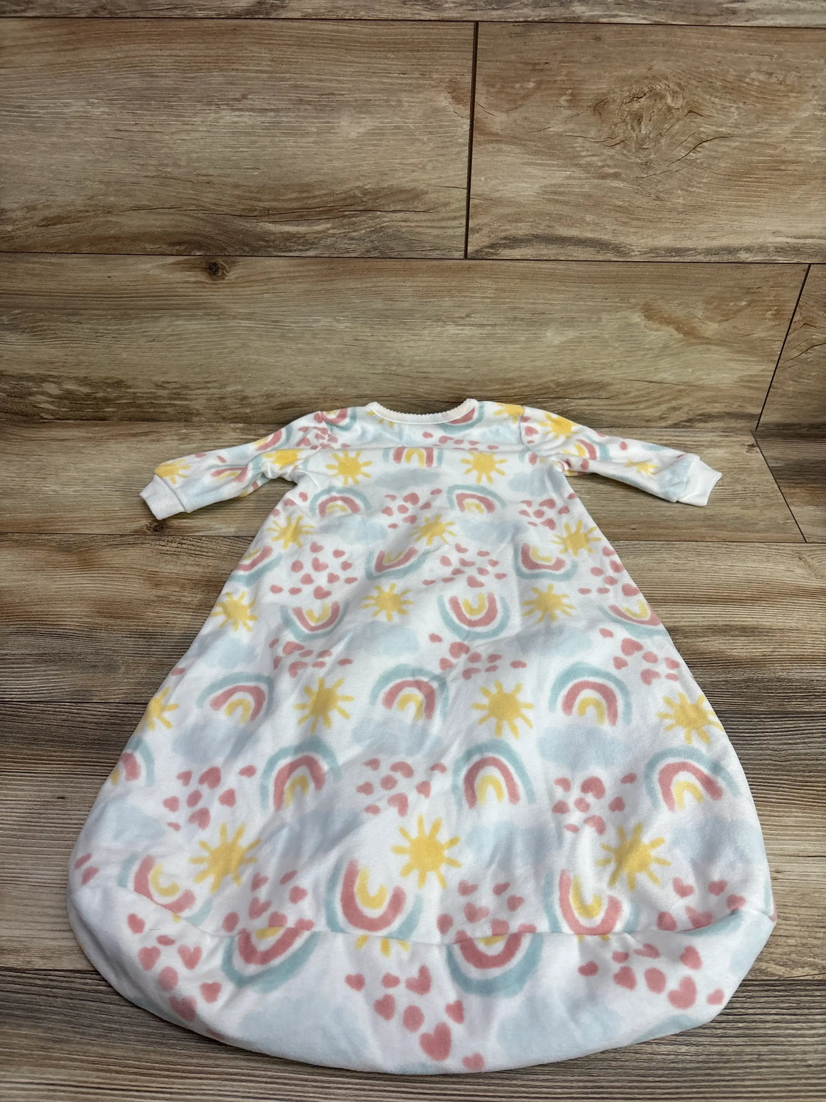 White Just One You baby blanket sleep sack with colorful rainbows, suns, and hearts pattern