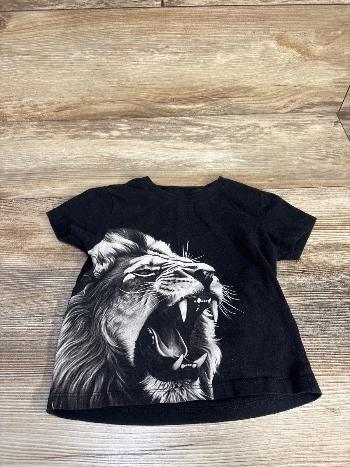 Black Guess Kids toddler t-shirt featuring a graphic of a roaring lion's head