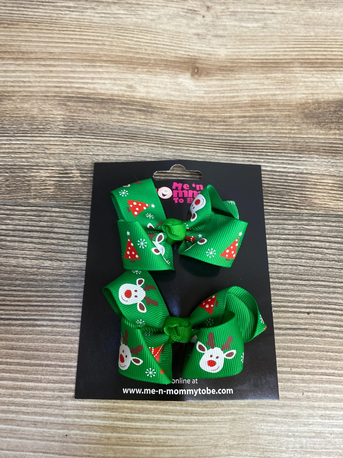 Green Christmas hair bows with reindeer and tree print for kids, festive holiday accessory