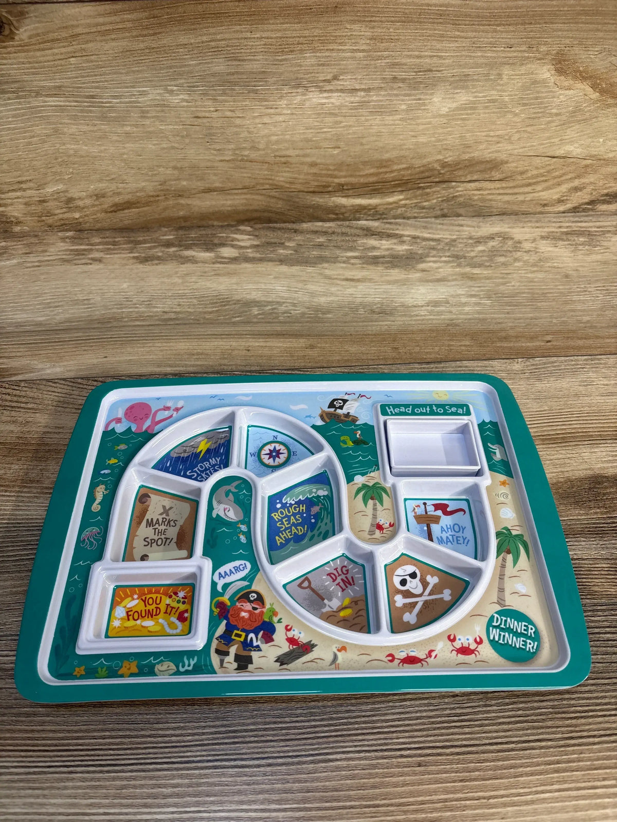 Pirate-themed kids' divided meal tray with colorful sections and playful sea graphics