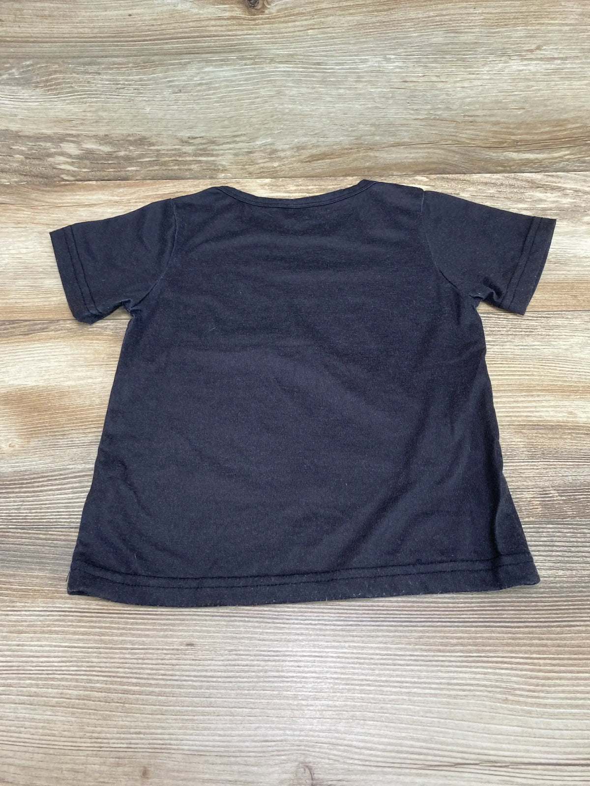 Back view of One More Time Gamer black toddler tee size 2T showing short sleeves and crew neck on light wood background