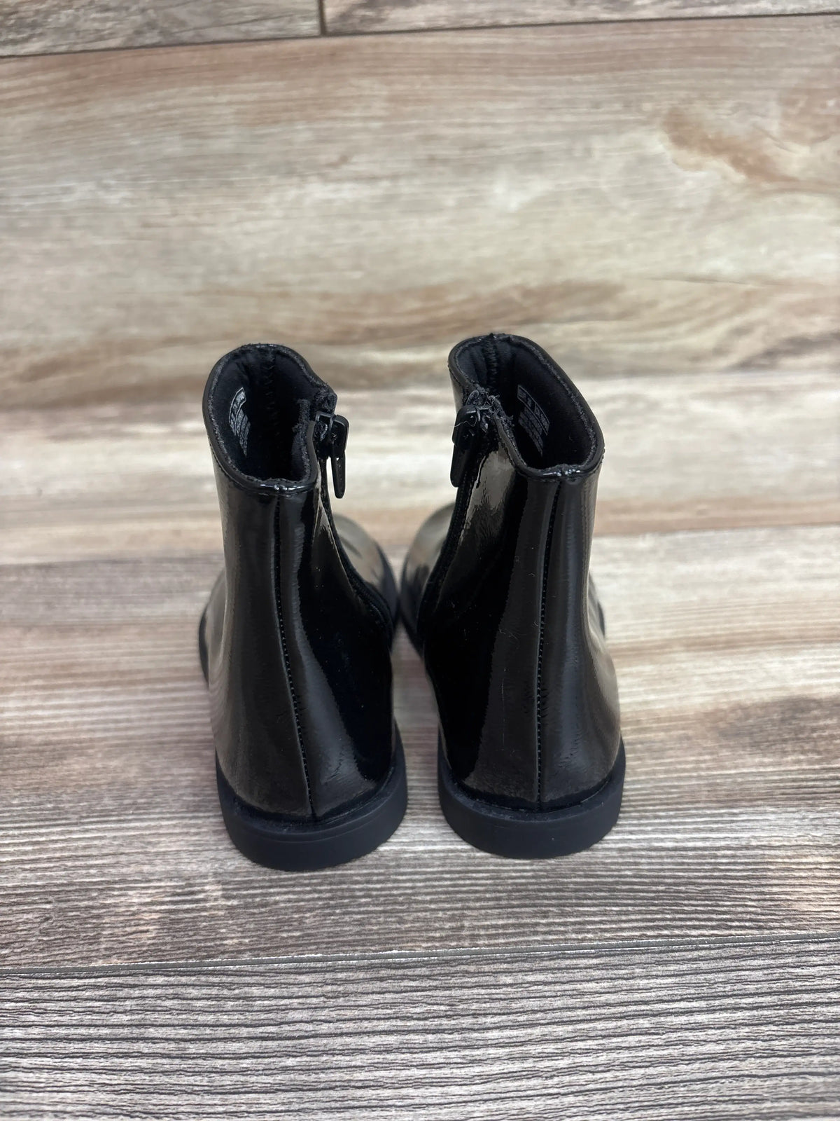 Rear view of Zara black patent finish ankle boots for kids