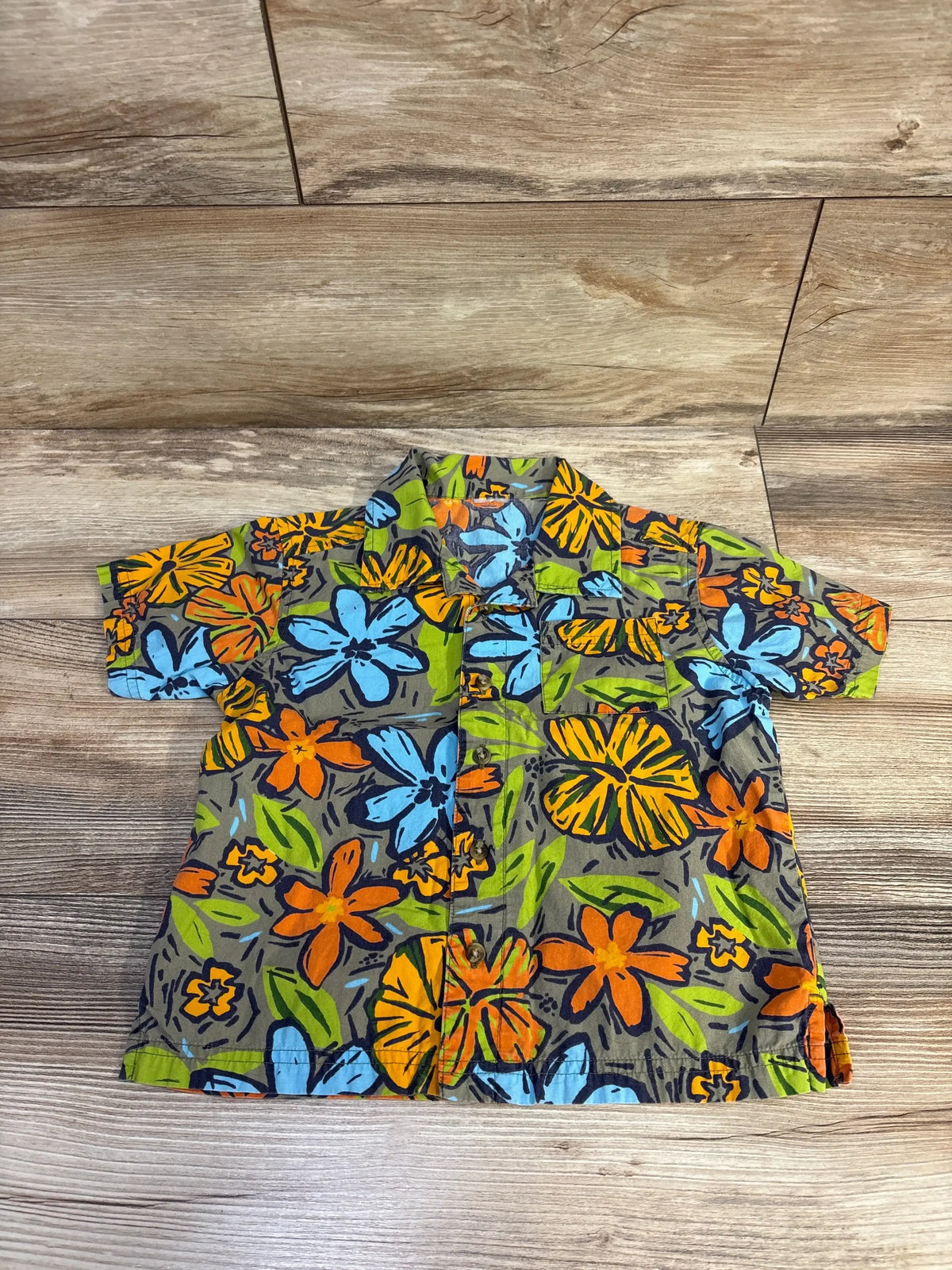 Front view of Gymboree Everglades shirt in green, size 4T, with floral print, chest pocket, short sleeves, and spread collar
