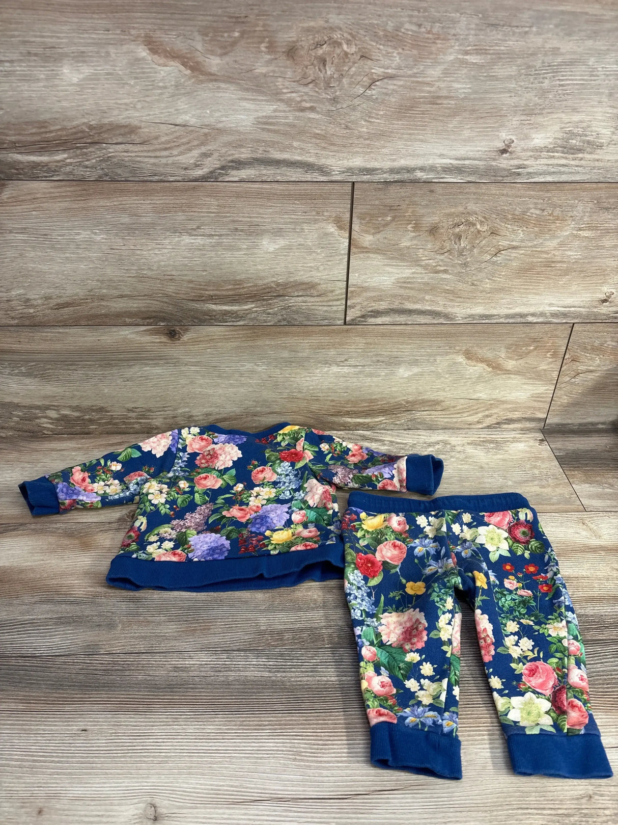 Baby floral outfit set with long sleeve top and pants, colorful flowers on blue background