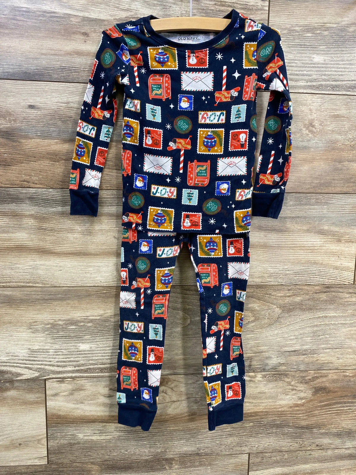 Kids' Christmas pajamas with festive stamp print, navy blue, holiday-themed design