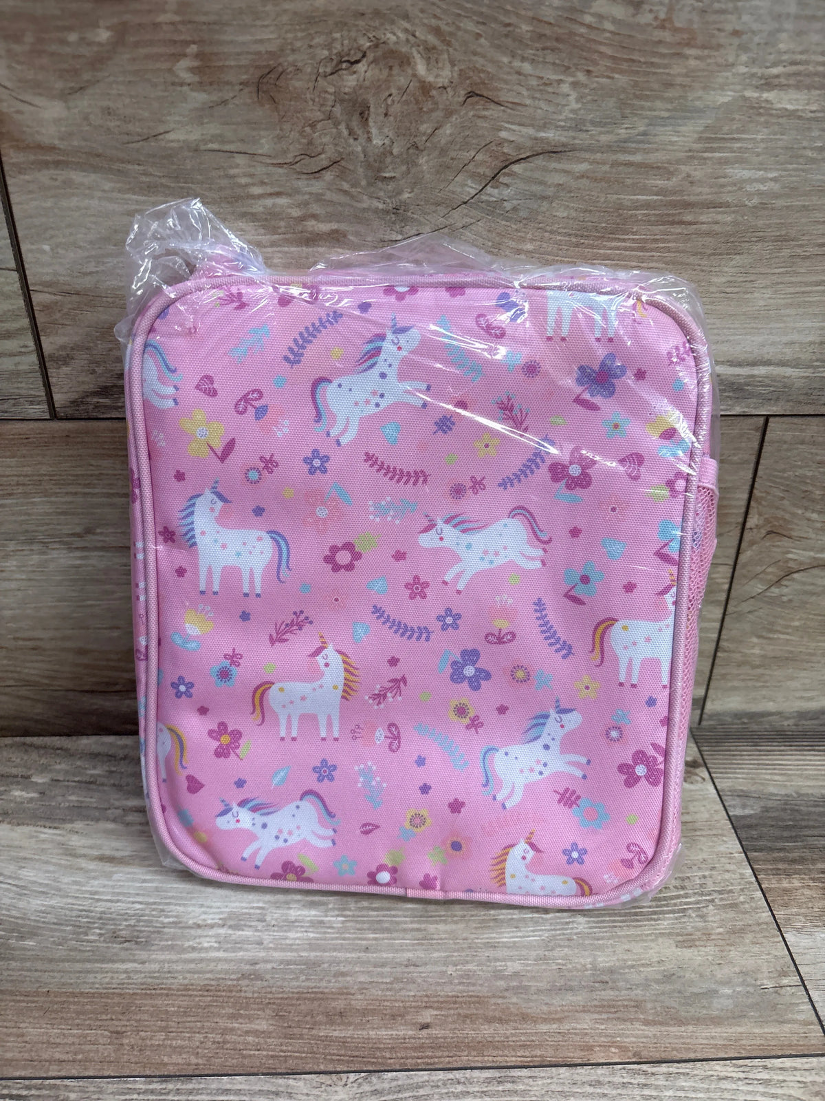 Pink Bagseri insulated kids lunch box with glitter unicorn and flower pattern in plastic wrap