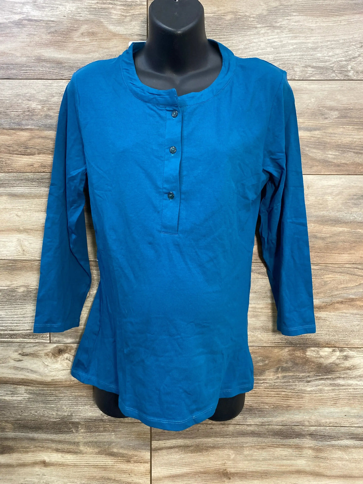 Front view of blue maternity nursing henley (size large) with three-button nursing placket and 3/4 sleeves on black mannequin